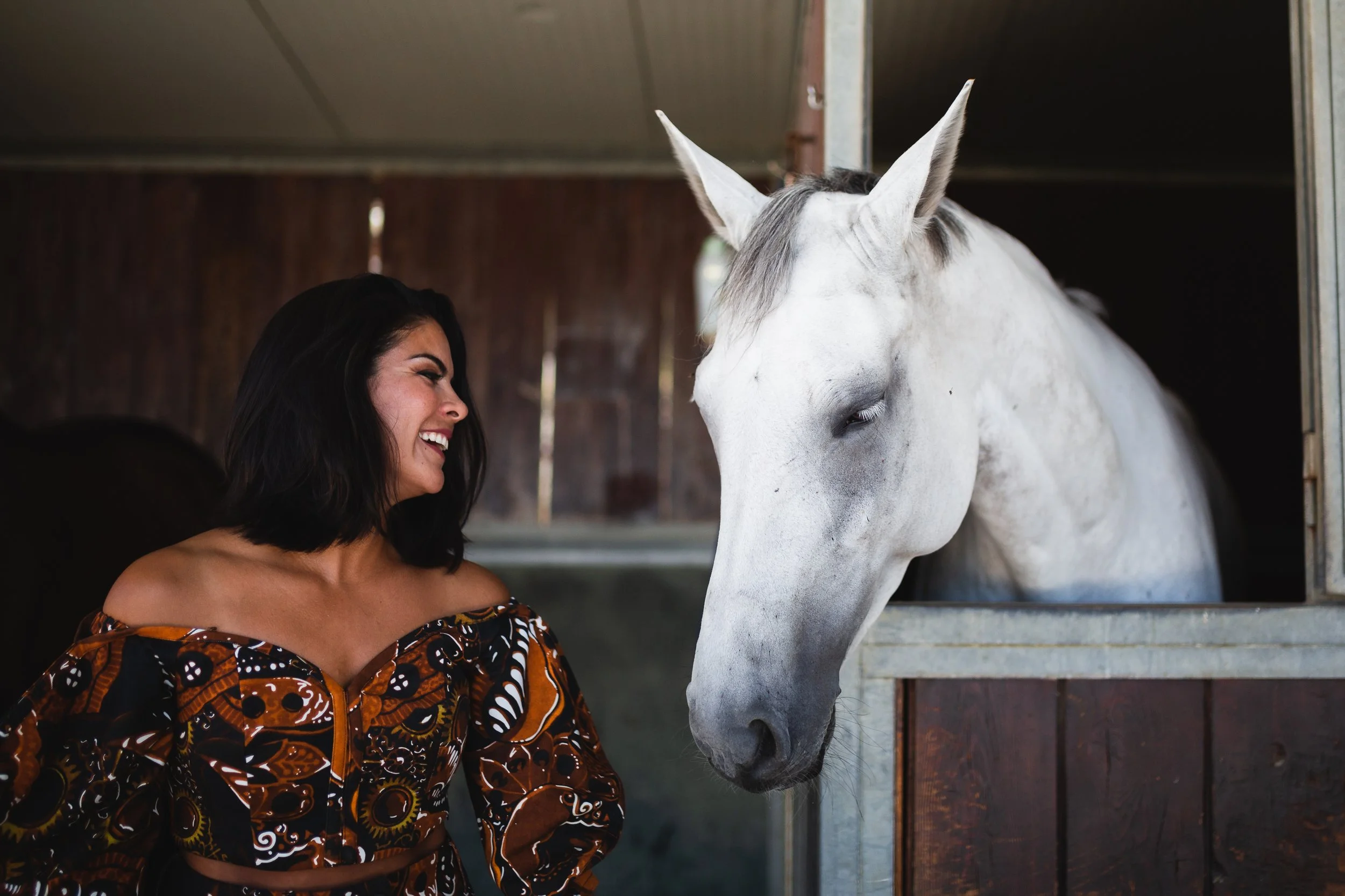 Emilia Ana Lopez, founder of Off Market Niseko, with a white horse.