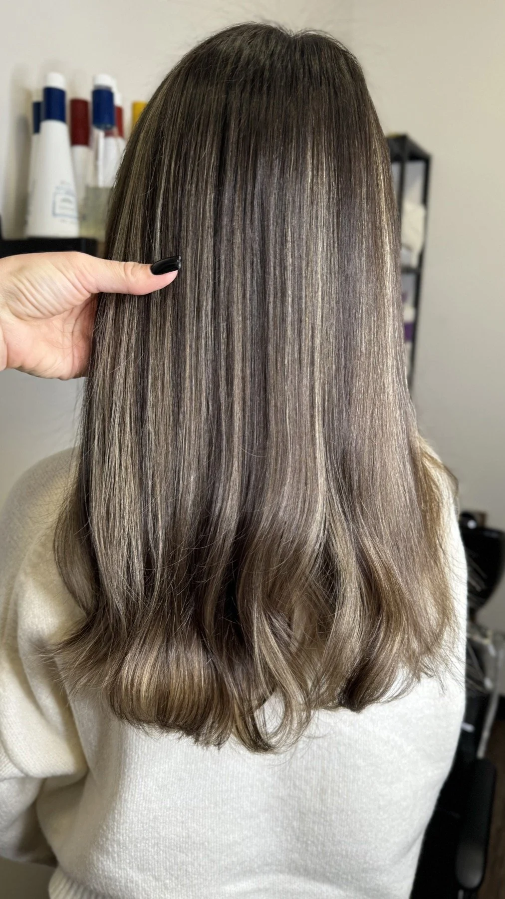 Dimensional brunette hair color with soft waves by Anna Stalmakova
