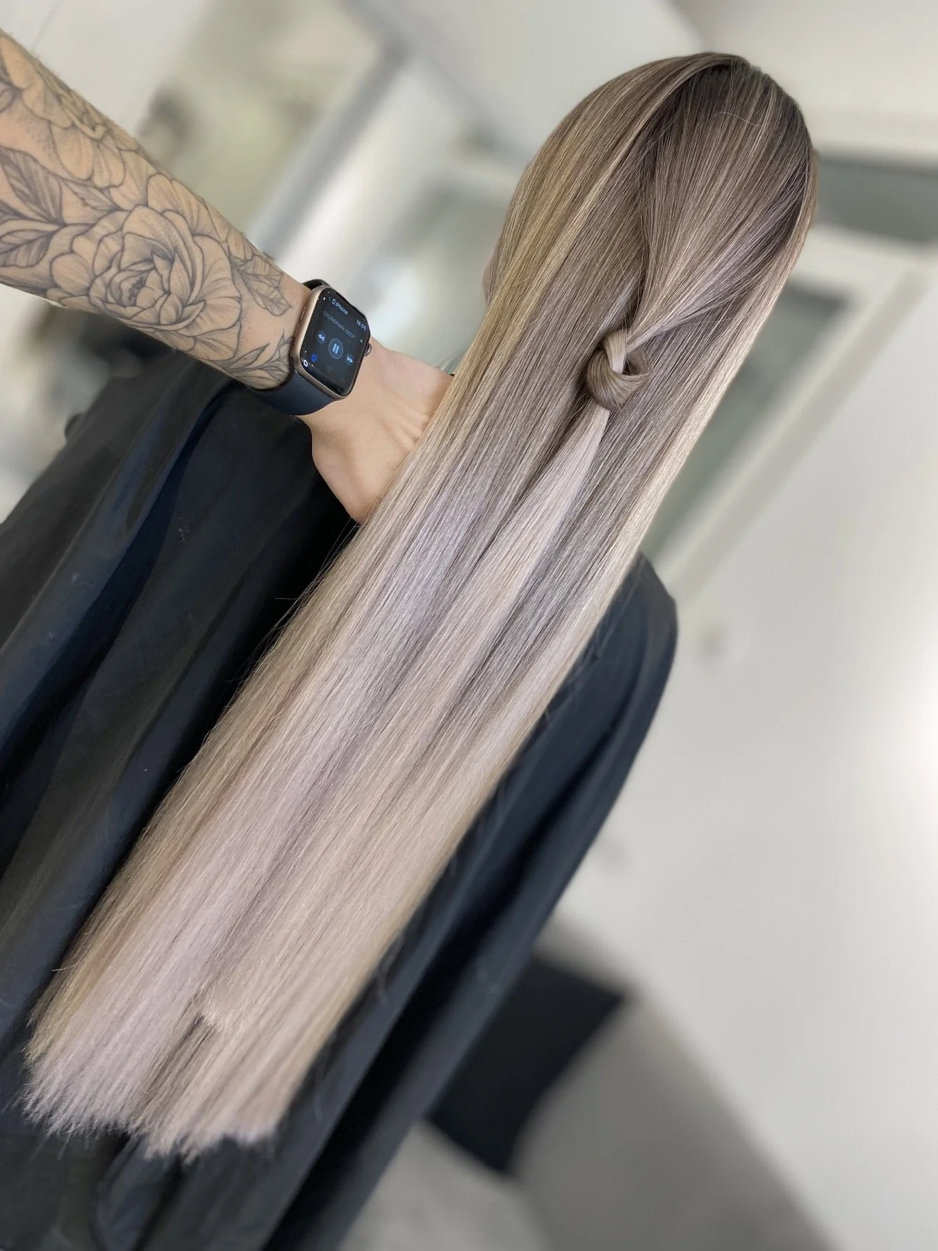 Smooth long blonde hair with a soft root transition by Anna Stalmakova