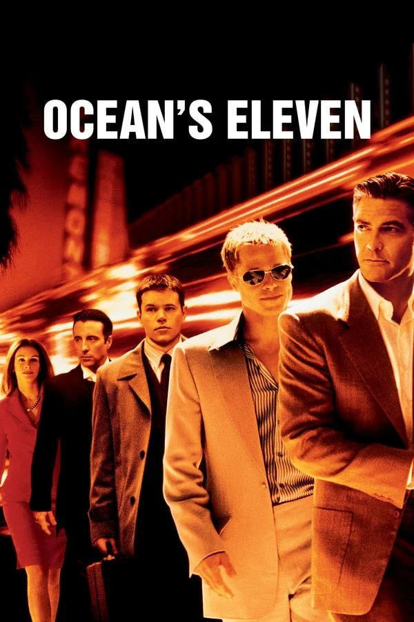 Poster for the movie 'Ocean's Eleven' featuring five main characters dressed in suits, standing in a row against a background with streaks of light and a blurred cityscape.