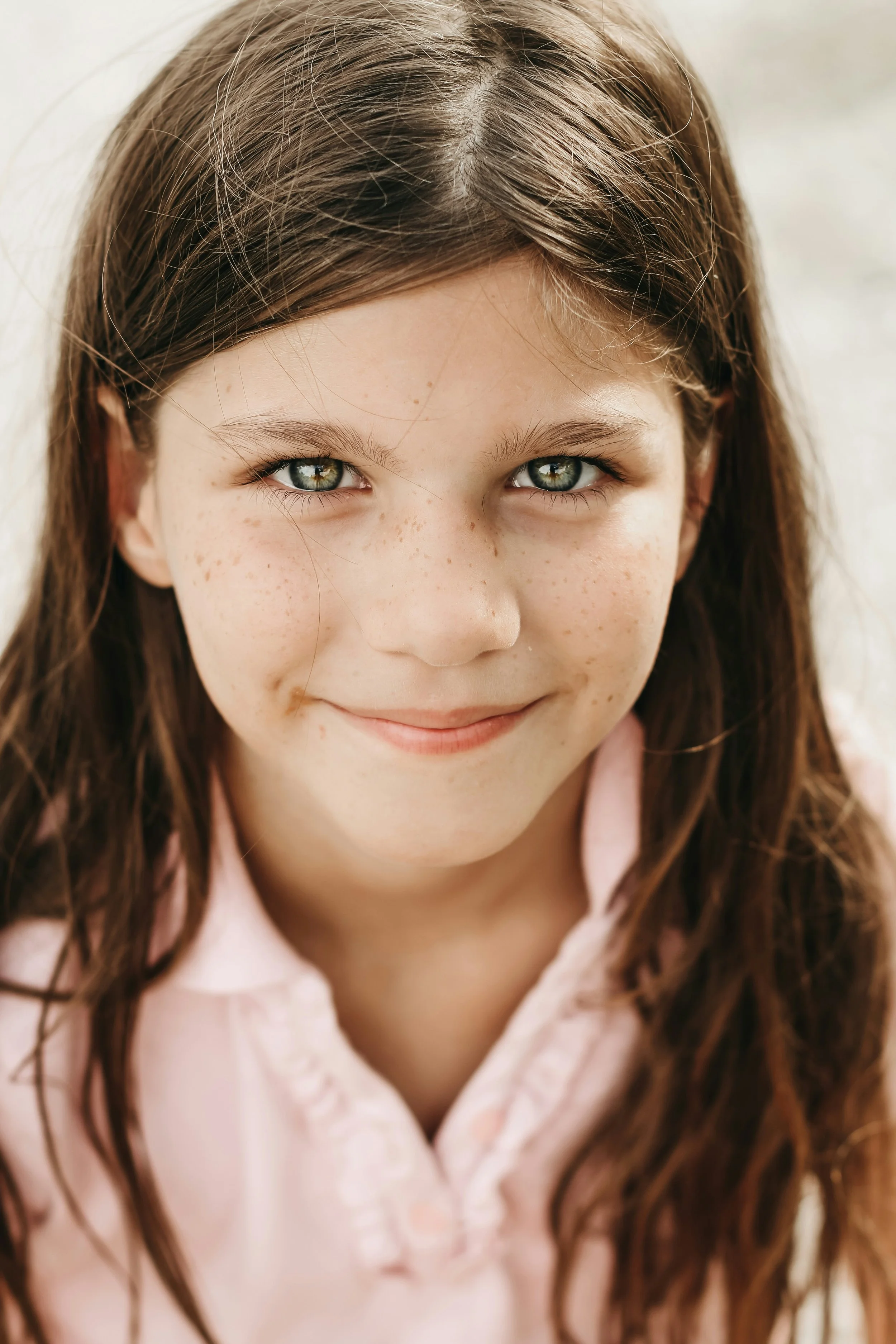 Portrait of a smiling young girl — representing safe, compassionate, developmentally attuned child therapy at REST Clinic