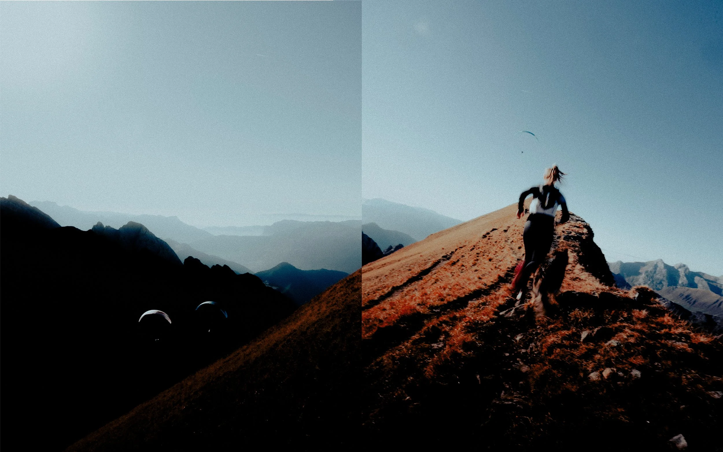 Une femme pratique la course à pied en montagne, avec un paysage de montagnes au loin, un ciel clair et des parapentes en vol.