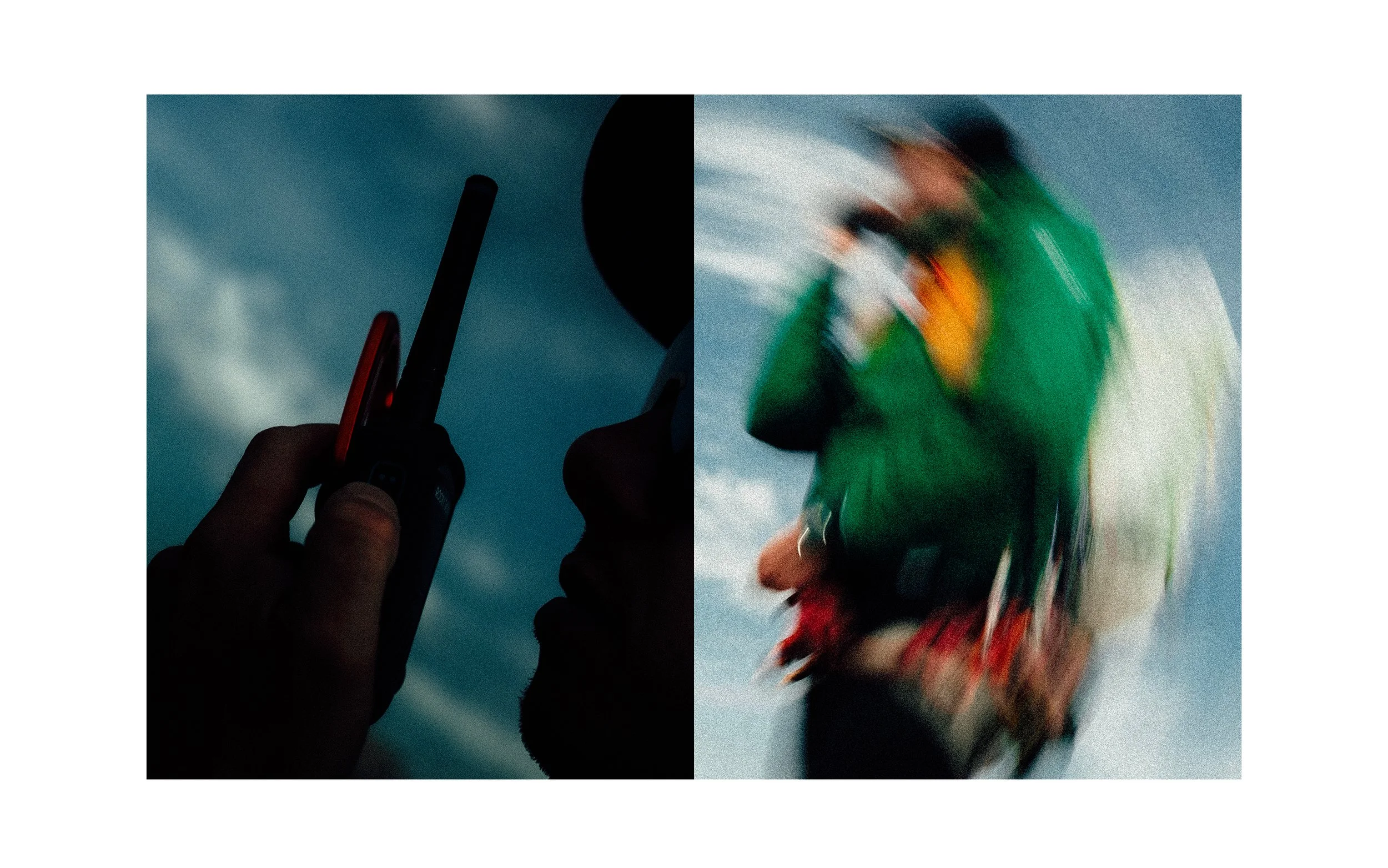 Une personne tient un téléphone portable en regardant vers le ciel, avec une autre personne portant un casque coloré, se déplaçant rapidement, créant un flou.