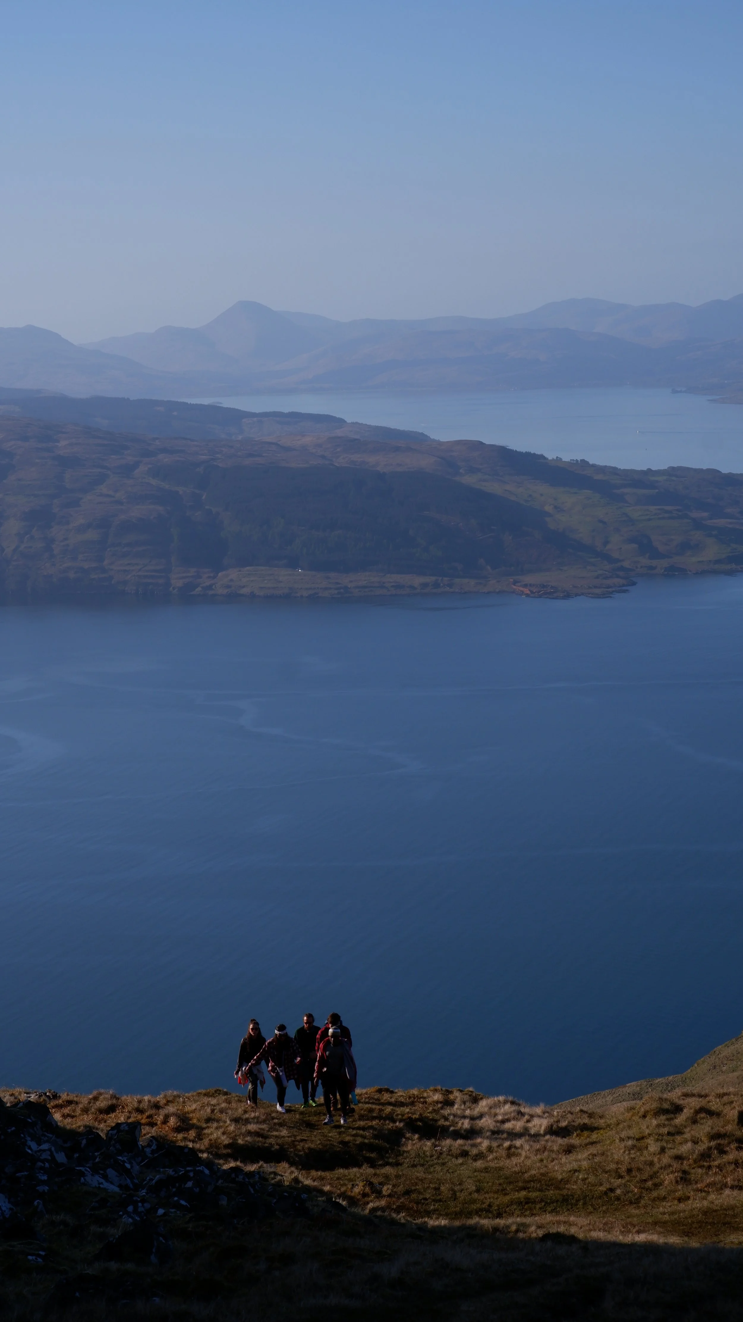 Young adults climbing Ben Hiant