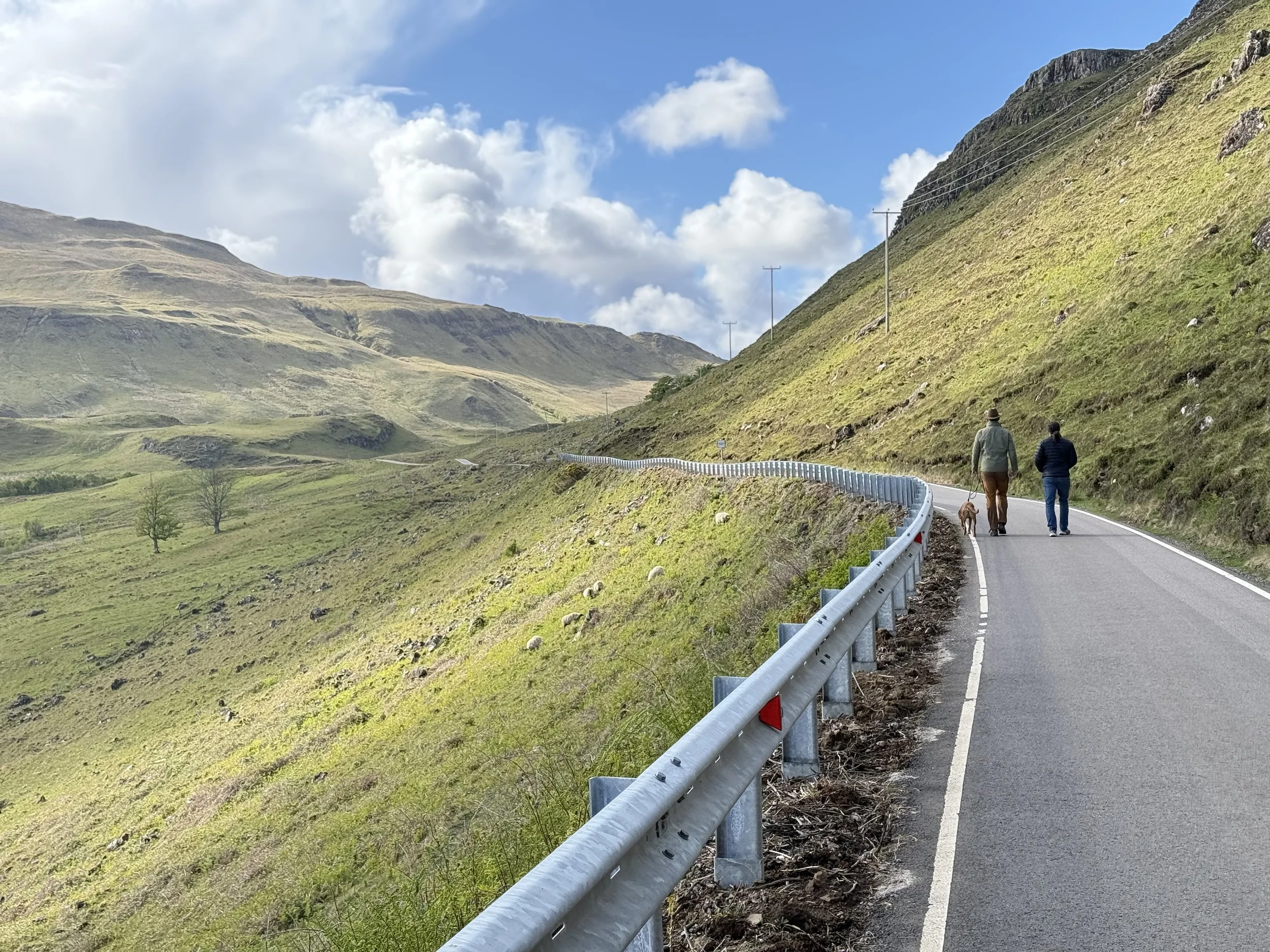 Howard and leader walking along road at camas nan gall