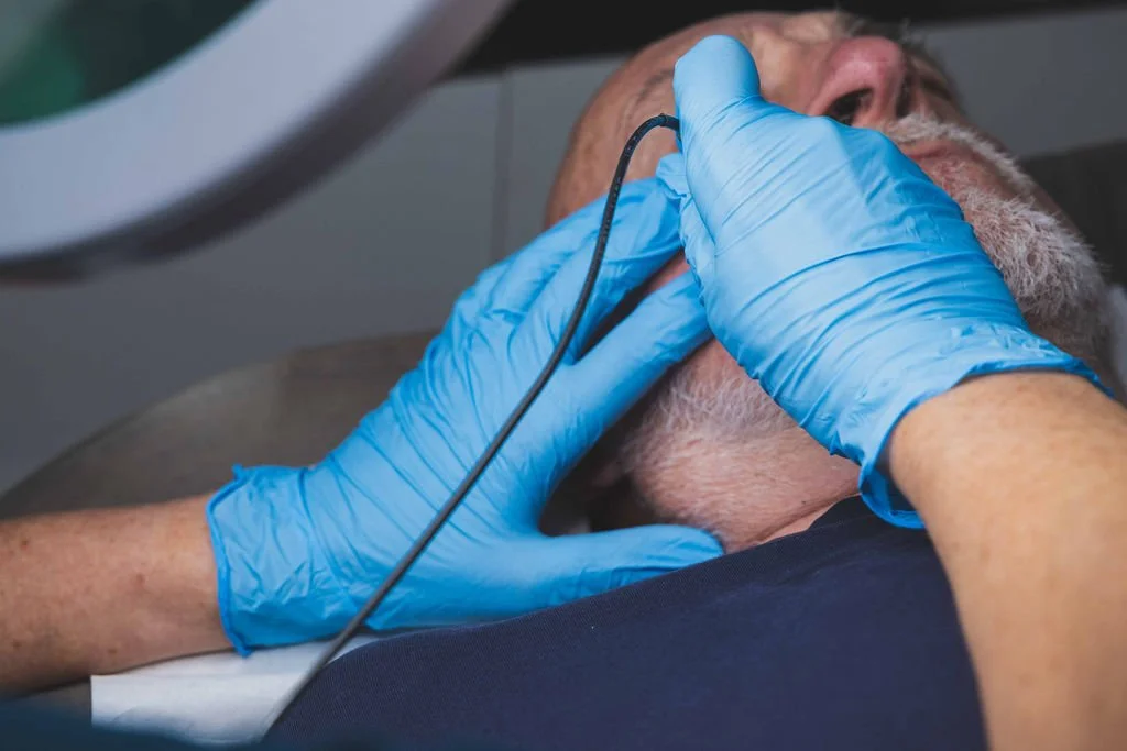 Sarah Hurst performing Advanced Electrolysis close to a client’s eye at her Brighton clinic