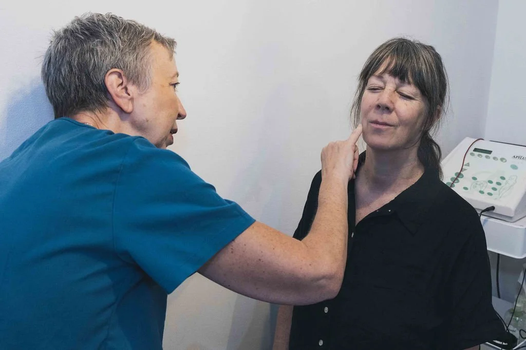 Sarah Hurst carefully assessing a client’s skin before Advanced Electrolysis treatment at her Brighton clinic.