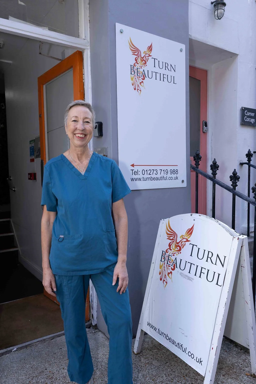 Sarah Hurst standing outside Turn Beautiful clinic in Brighton, where she offers Advanced Blemish Removal.