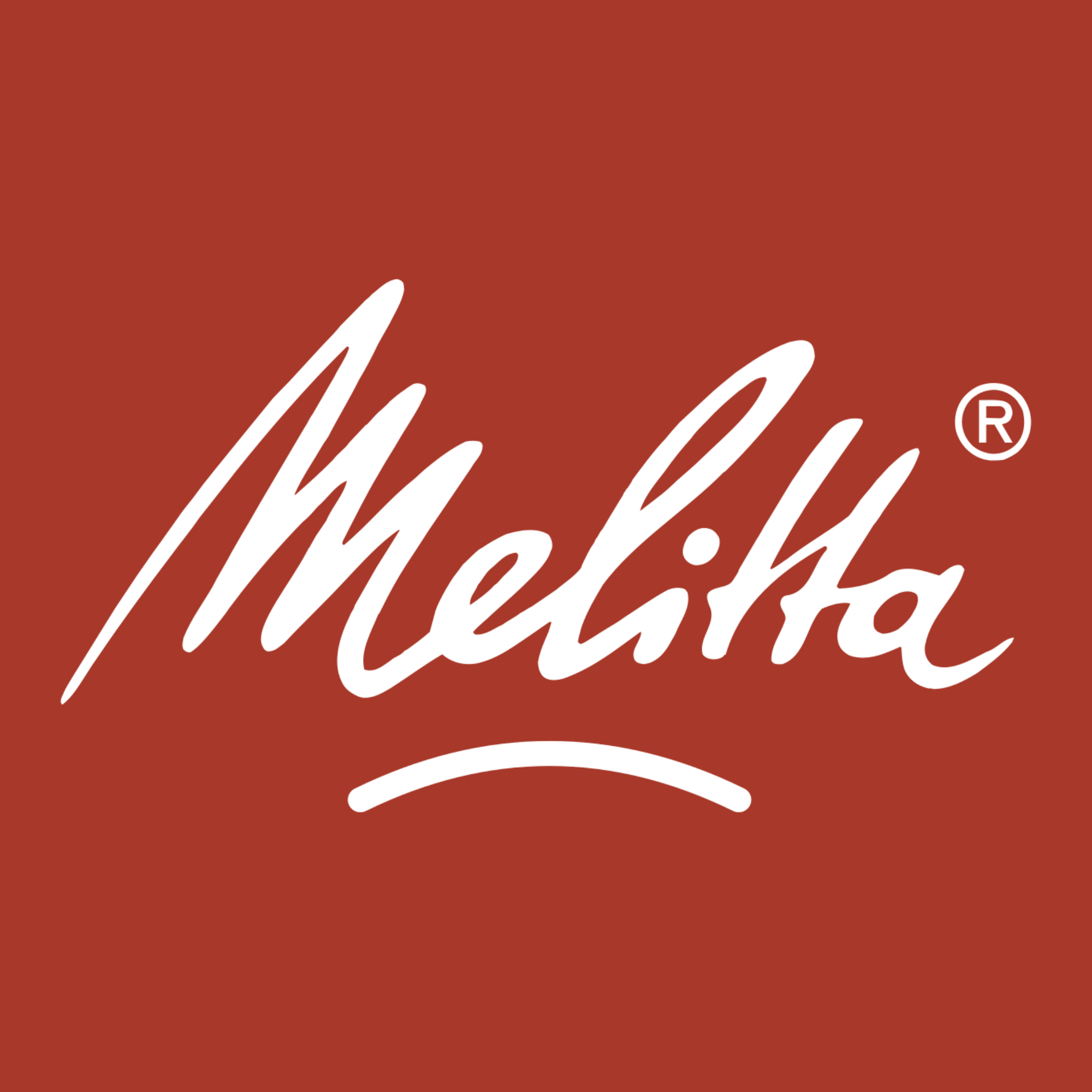 Close-up of a red-brown background with white cursive text reading "a" and a registered trademark symbol.