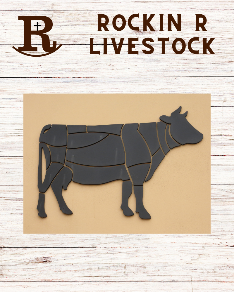 A wall-mounted puzzle of a cow, composed of separate pieces, with the words "Rockin R Livestock" and a logo resembling a stylized letter R with a cross and a curved line underneath, on a white wooden background.