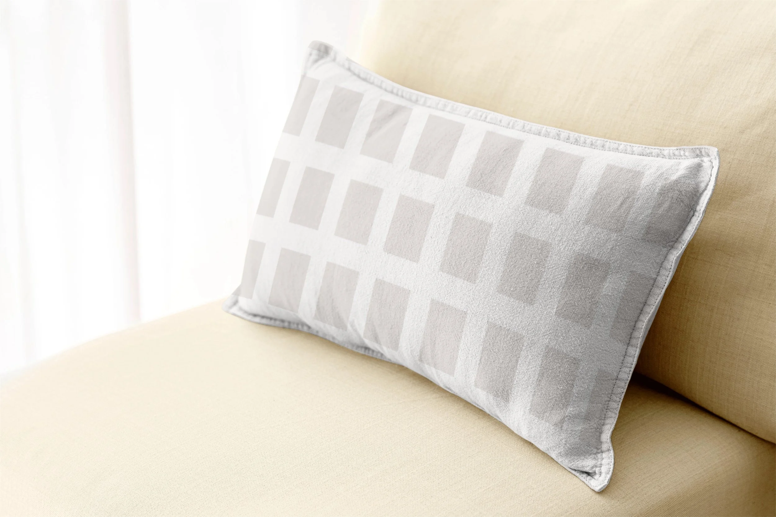 Cozy Taupe Squares - 
Gentle taupe squares create an understated accent, perfect for layering warmth and quiet pattern into your home.