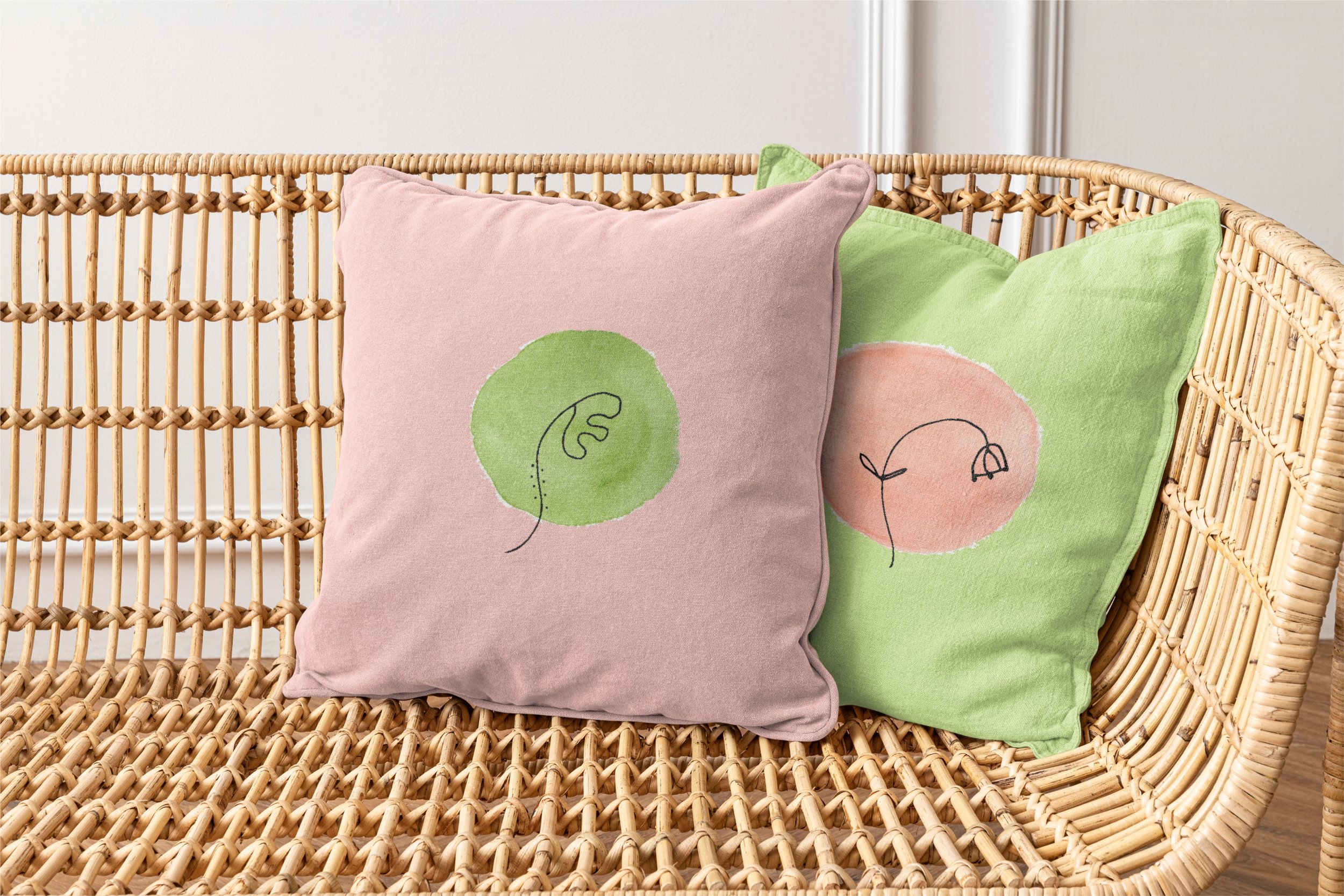 Pink and green Ode to Tiny Flowers throw pillows with simple hand drawn botanical illustrations.