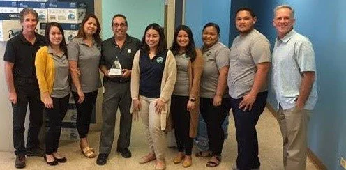 Guam solid waste team members holding the award for the Ordot Dump closure project