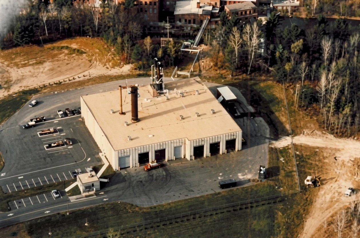 Aerial view of the Pittsfield Resource Recovery Facility in Pittsfield, Massachusetts, with the Crane & Co. mill buildings beyond