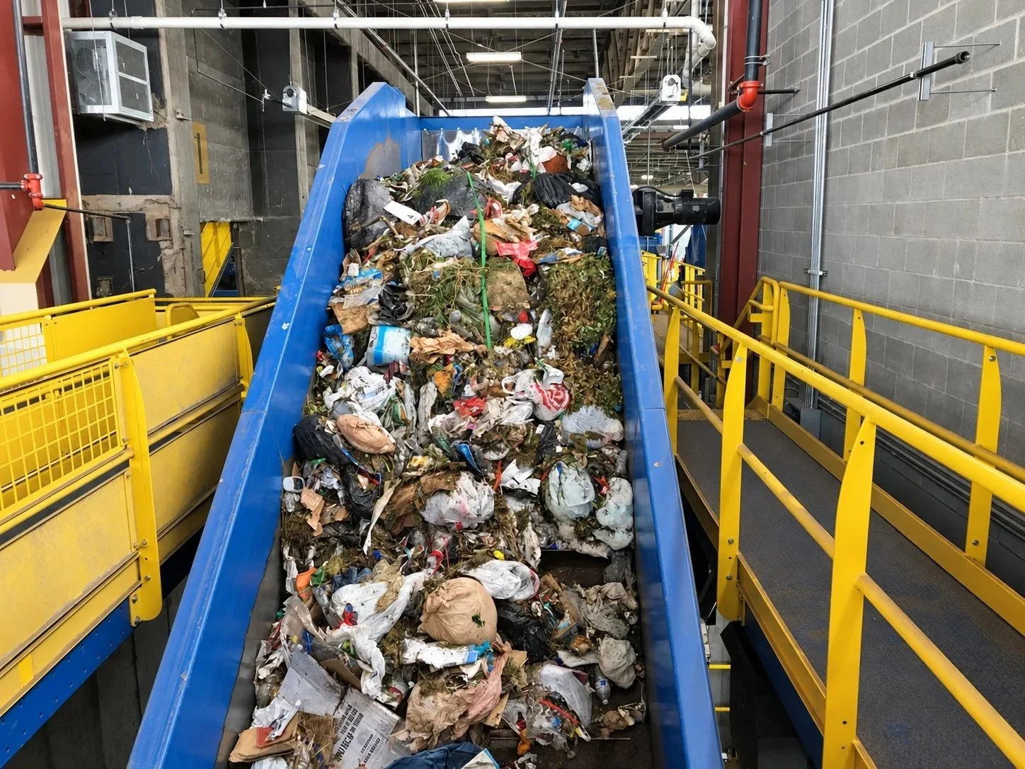 Mixed waste on the infeed conveyor at the Wasatch mixed waste processing facility