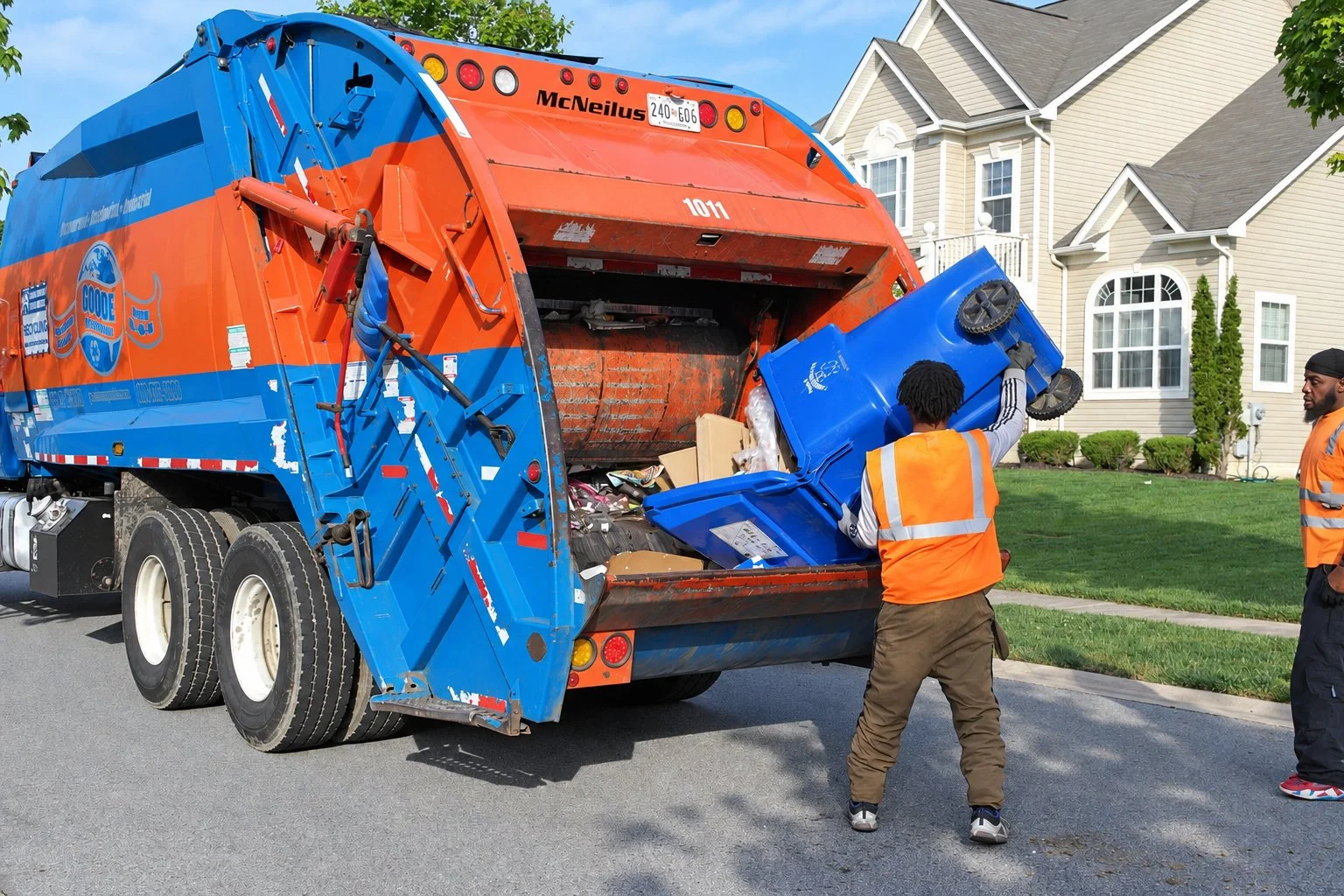 Crew emptying a recycling cart on a residential route in Charles County, Maryland