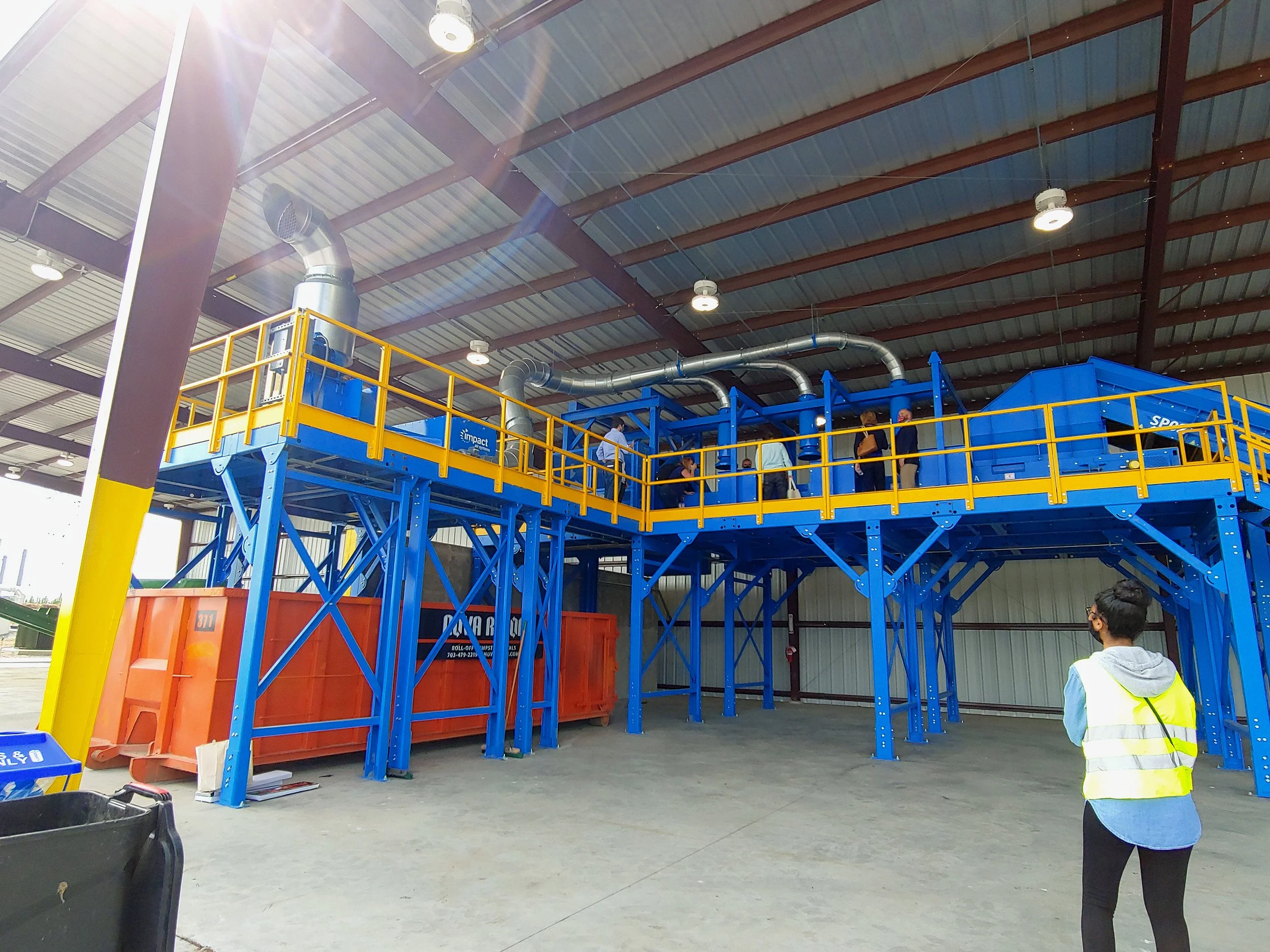 Materials recovery facility interior with sorting equipment