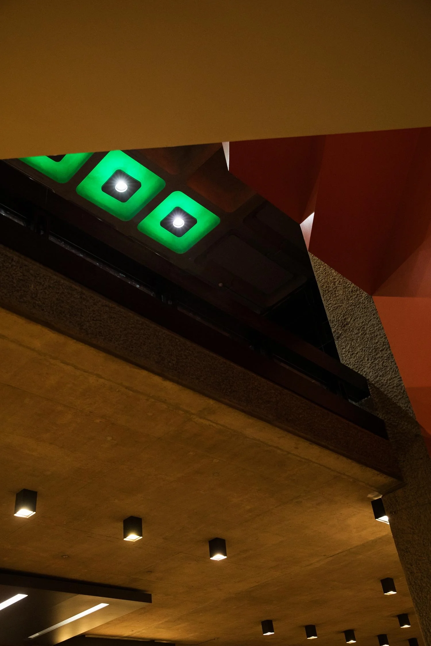Colourful ceiling detail contrasting with the Barbican's concrete interior.