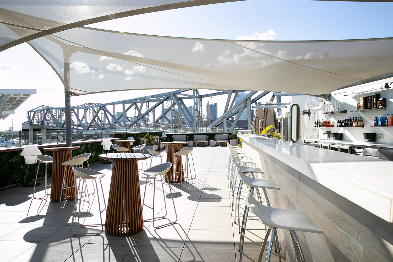 Open-air waterfront bar and terrace designed for relaxed Mediterranean gatherings.