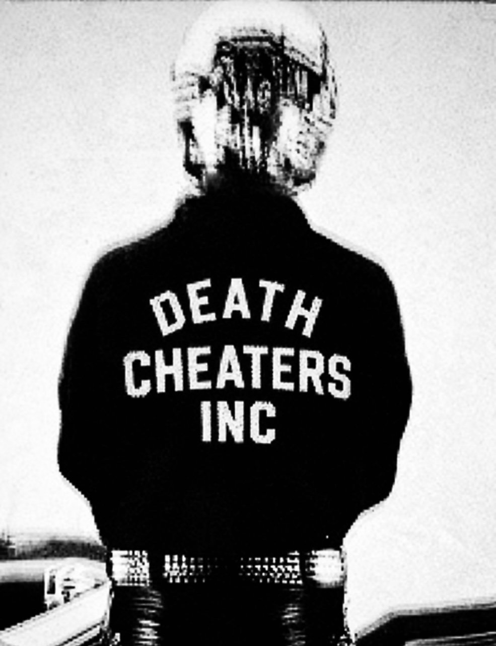 Back of person wearing a jacket with the words 'Death Cheaters Inc' written on it, standing in front of a plain wall.