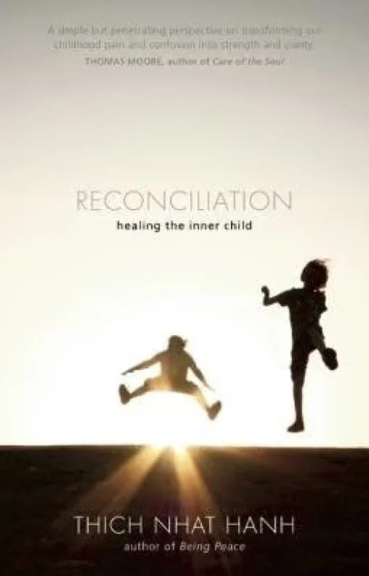 Book cover titled "RECONCILIATION" with the subtitle "healing the inner child". Silhouettes of a jumping child and a running child stand on a dark horizon, with a bright light or sun at the horizon, casting rays upward.