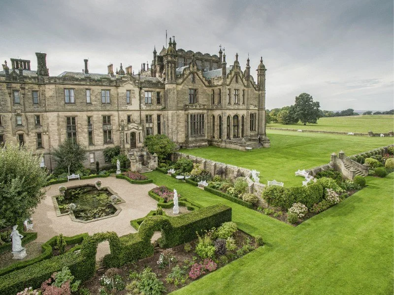 Allerton Castle, a Yorkshire wedding venue, with its formal gardens in daylight