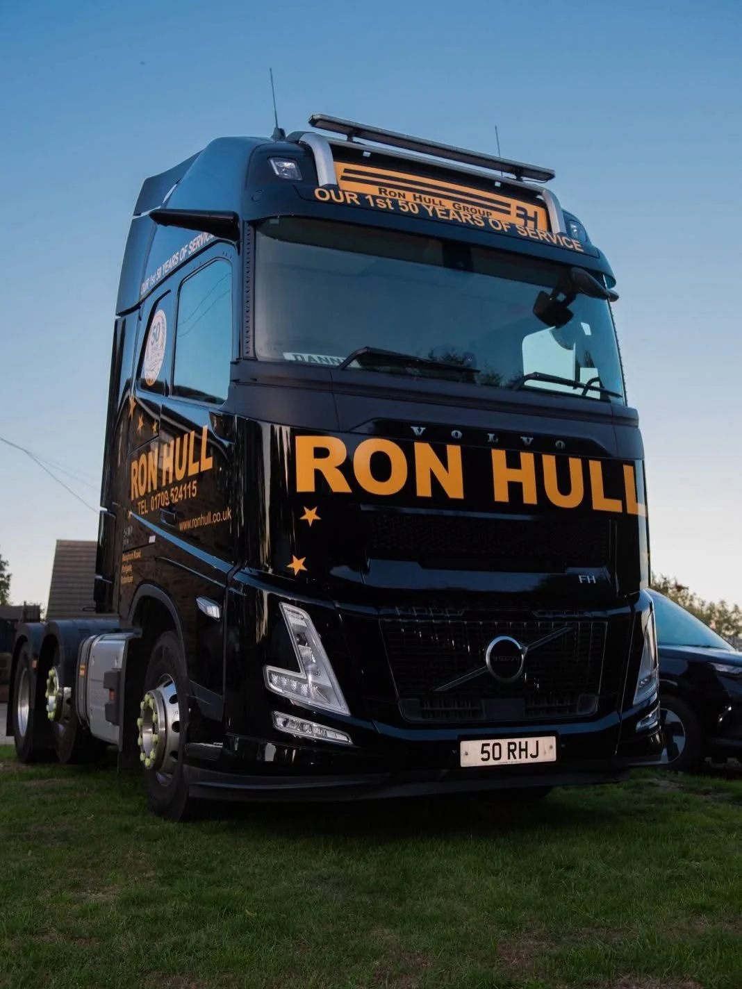 Black Ron Hull Volvo lorry with Our 1st 50 Years of Service lettering and 50 RHJ number plate