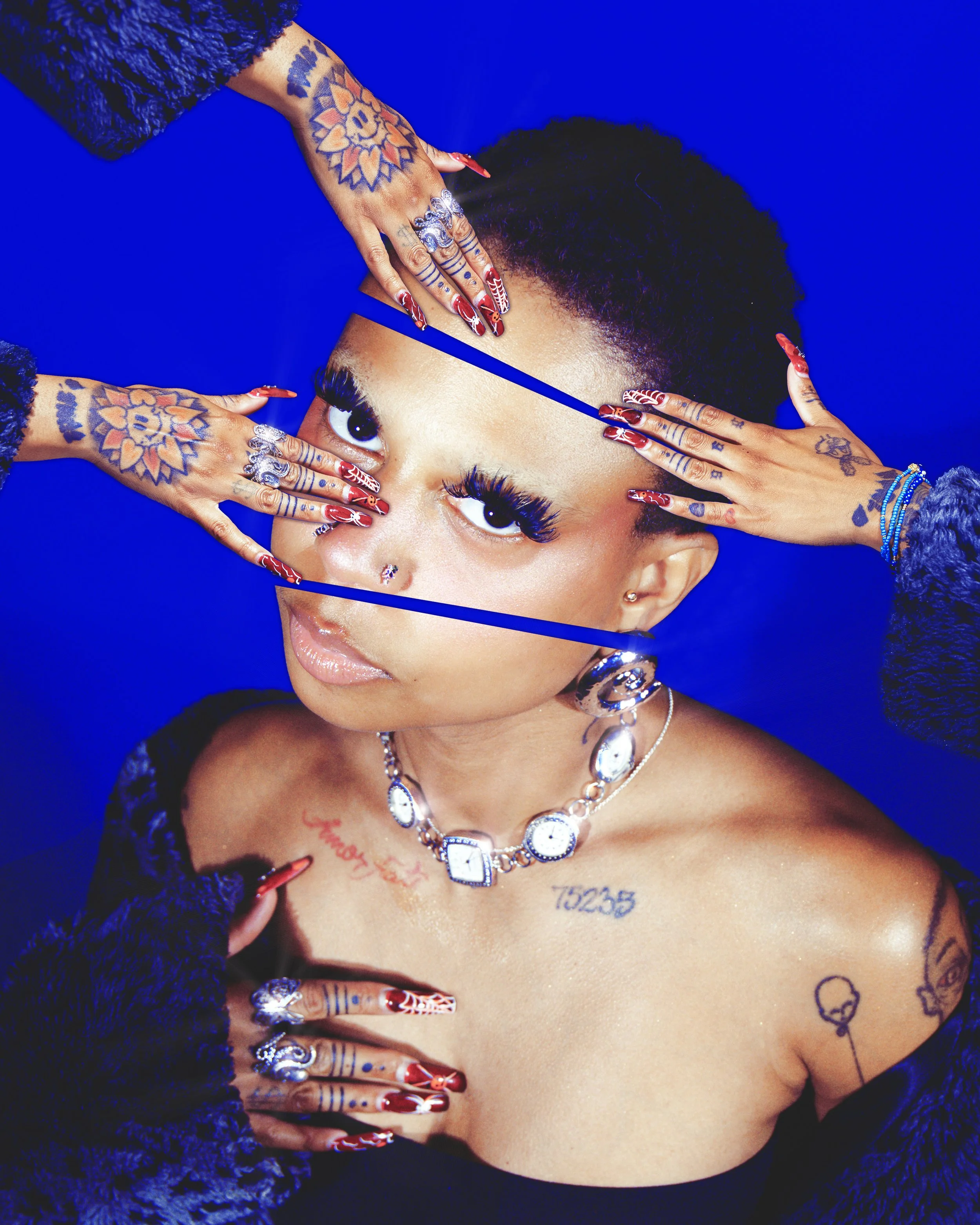Local Dallas, Texas, DFW Non-traditional Fashion Editorial Creative Portraits Cover Art Photographer Photoshoot. @tunebbyworld . A woman with short, natural hair and light skin holding her head with hands that have red and white painted nails, adorne