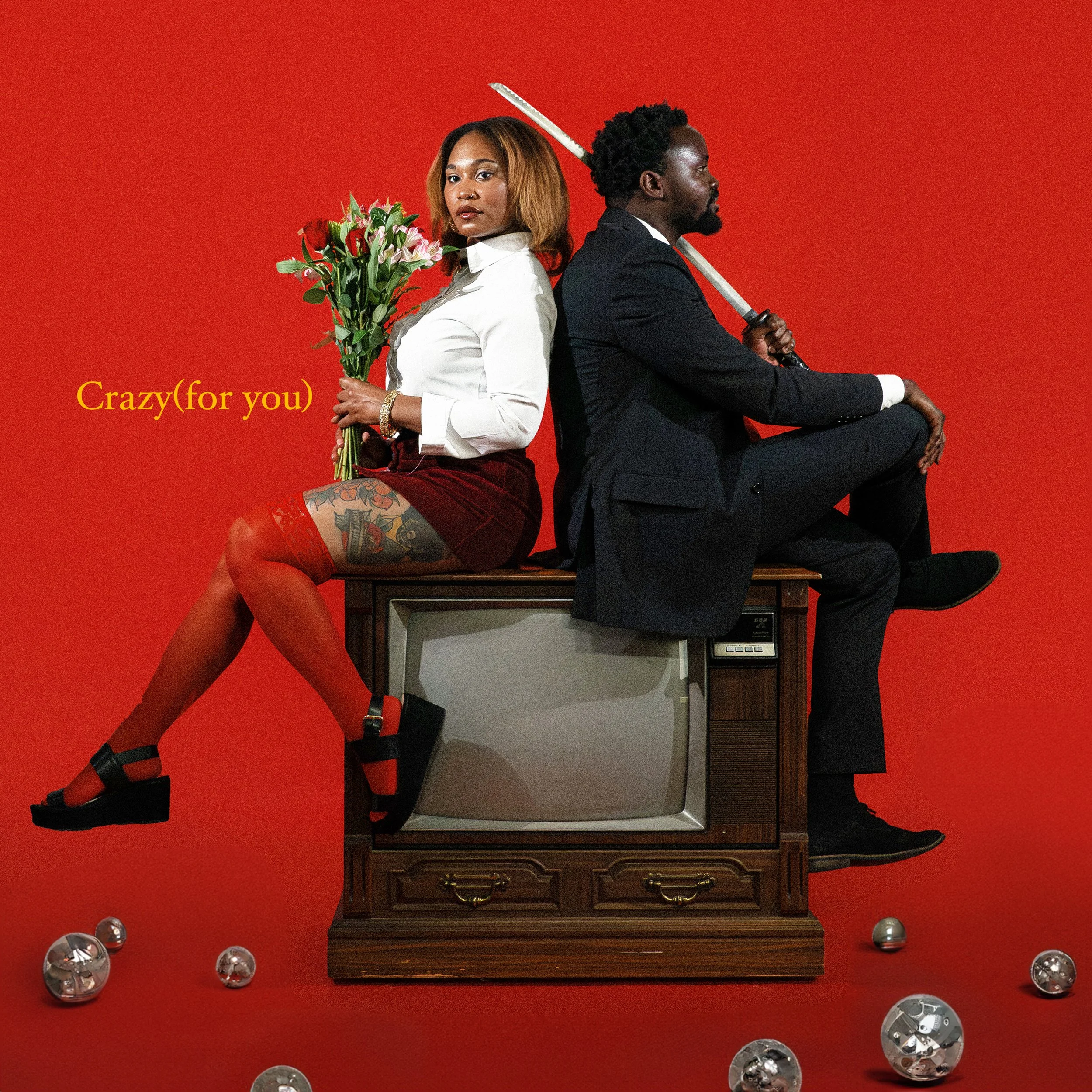 Creative portrait, album cover art of local Dallas, Texas musicians group band Igimeji . A woman in a white shirt and red skirt sitting on a red armchair, holding a bouquet of flowers, with a tattooed leg and black heels. A man in a black suit with a