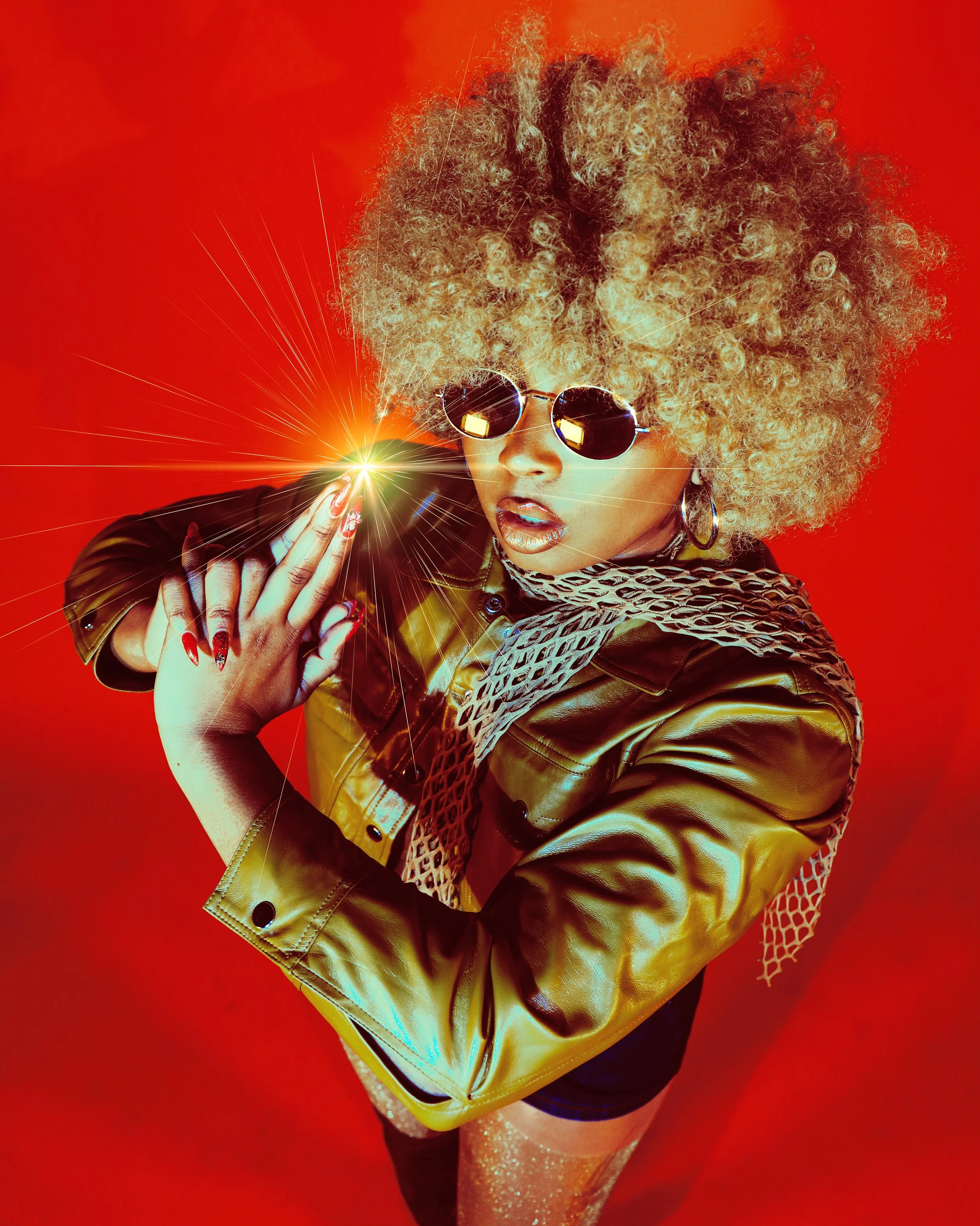 Local Dallas, Texas, DFW Non-traditional Fashion Editorial Creative Portraits Cover Art Photographer Photoshoot. Musician @Seiharaaa Foxxy Cleopatra . Woman with curly blonde hair wearing sunglasses, a shiny gold jacket, fishnet scarf, and sparkly ti