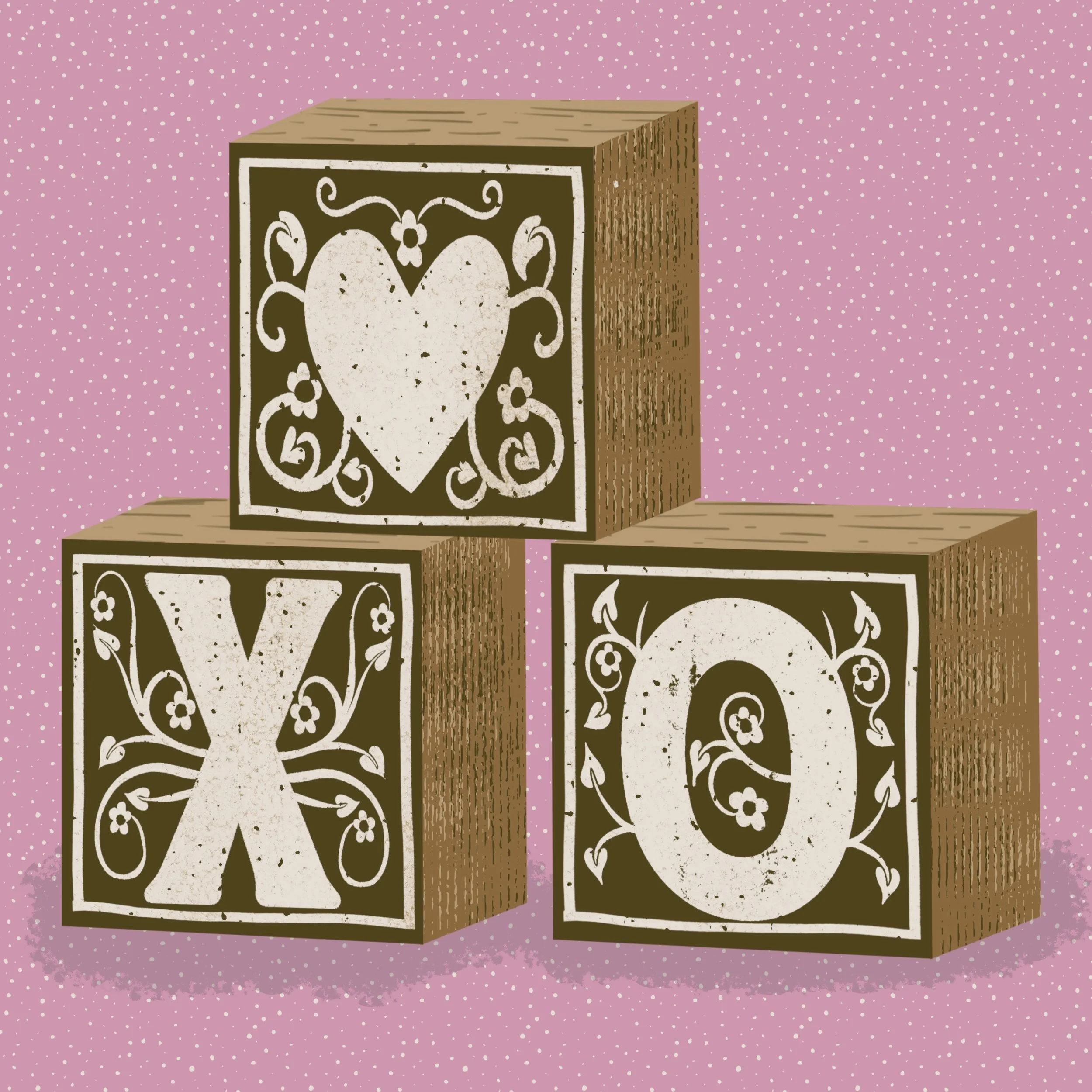 Stacked wooden blocks with decorative black and white floral and heart patterns on a pink, dotted background.