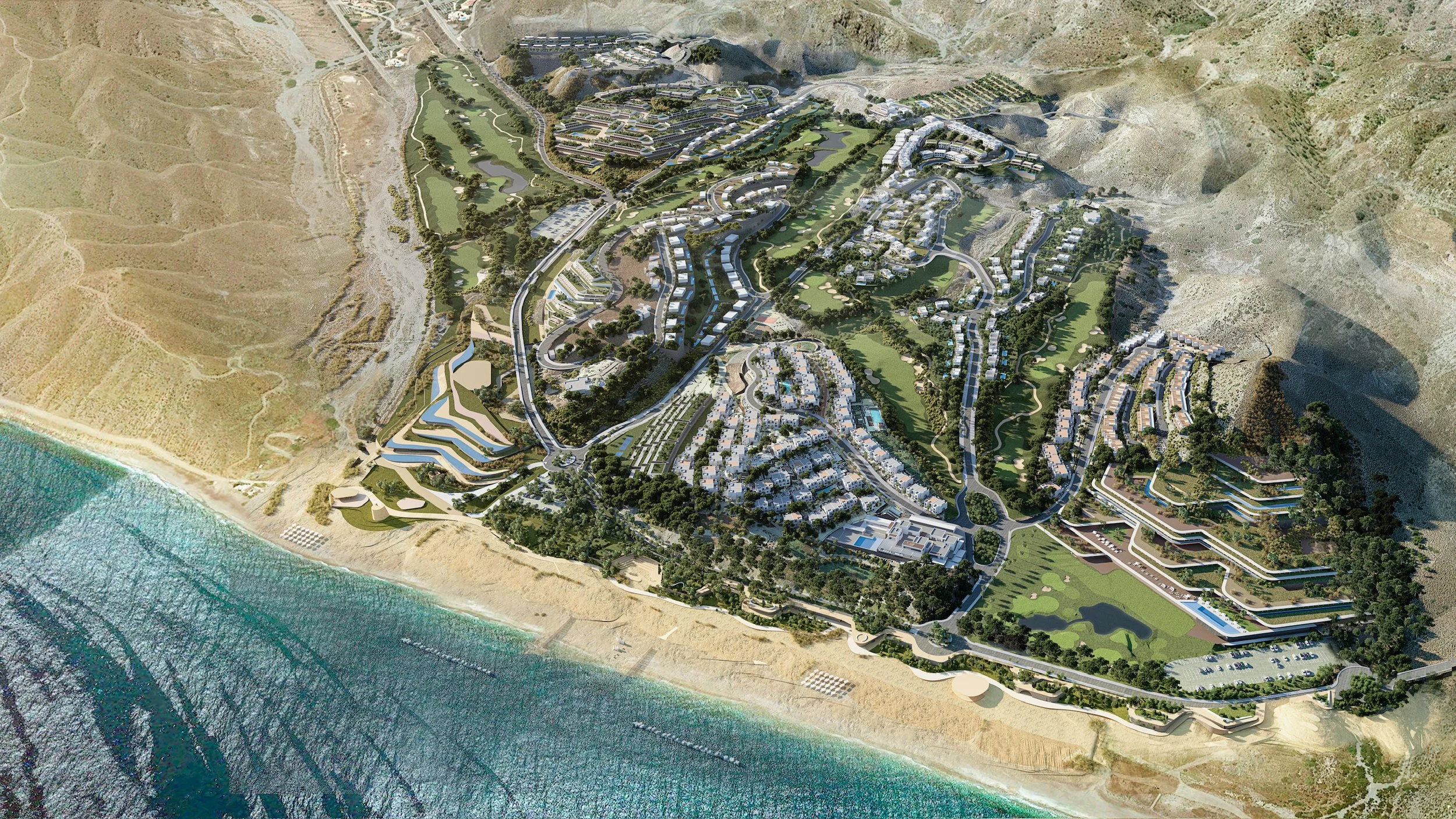 Aerial view of a coastal residential development with houses, roads, and green spaces next to the ocean.