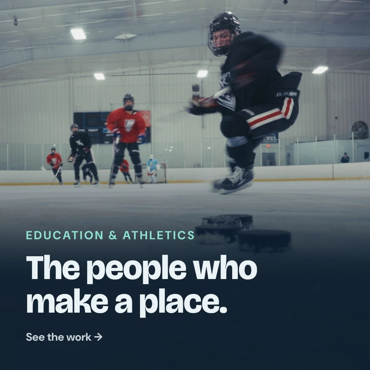 Education & Athletics: The people who make a place. A hockey team huddles on the ice before a game.