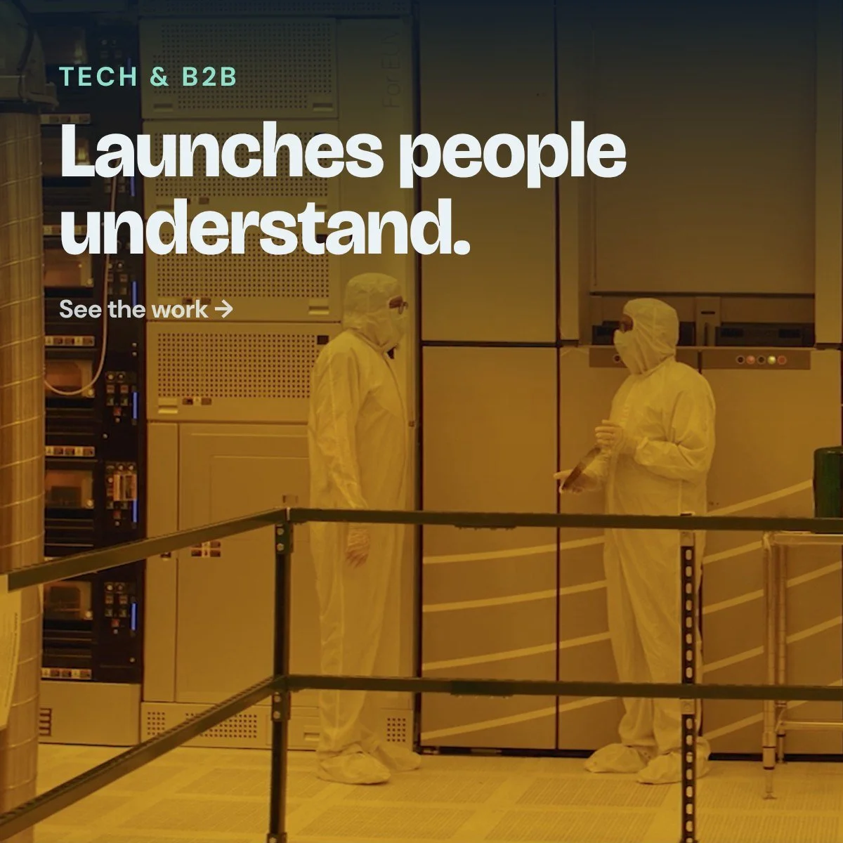 Tech & B2B: Launches people understand. Two engineers in clean suits in a semiconductor clean room.