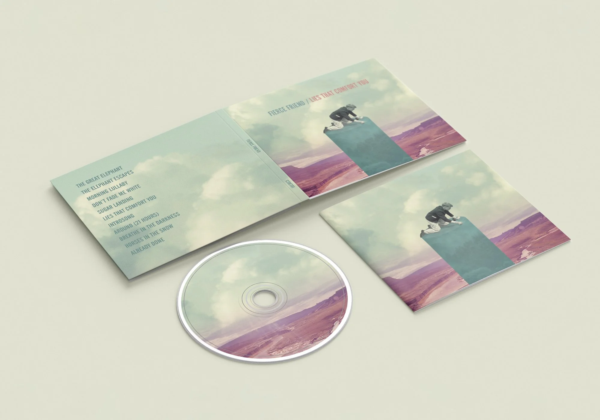 A CD, booklet, and folded paper with a landscape cover, all featuring a person in a black jacket kneeling on a hill with a scenic background of mountains and sky, and text including song titles and a phrase about a fierce friend.