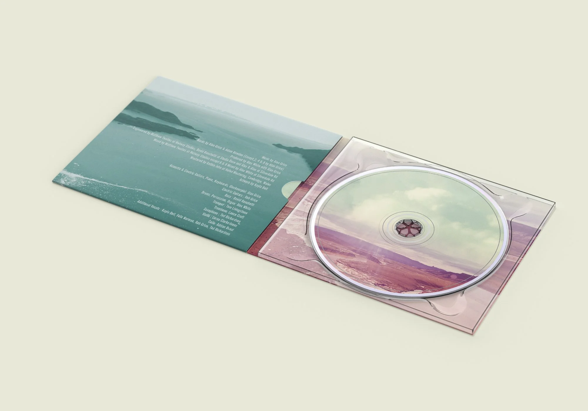 Open CD case with landscape artwork featuring mountains and water, and tracklist printed on the inside of the cover.