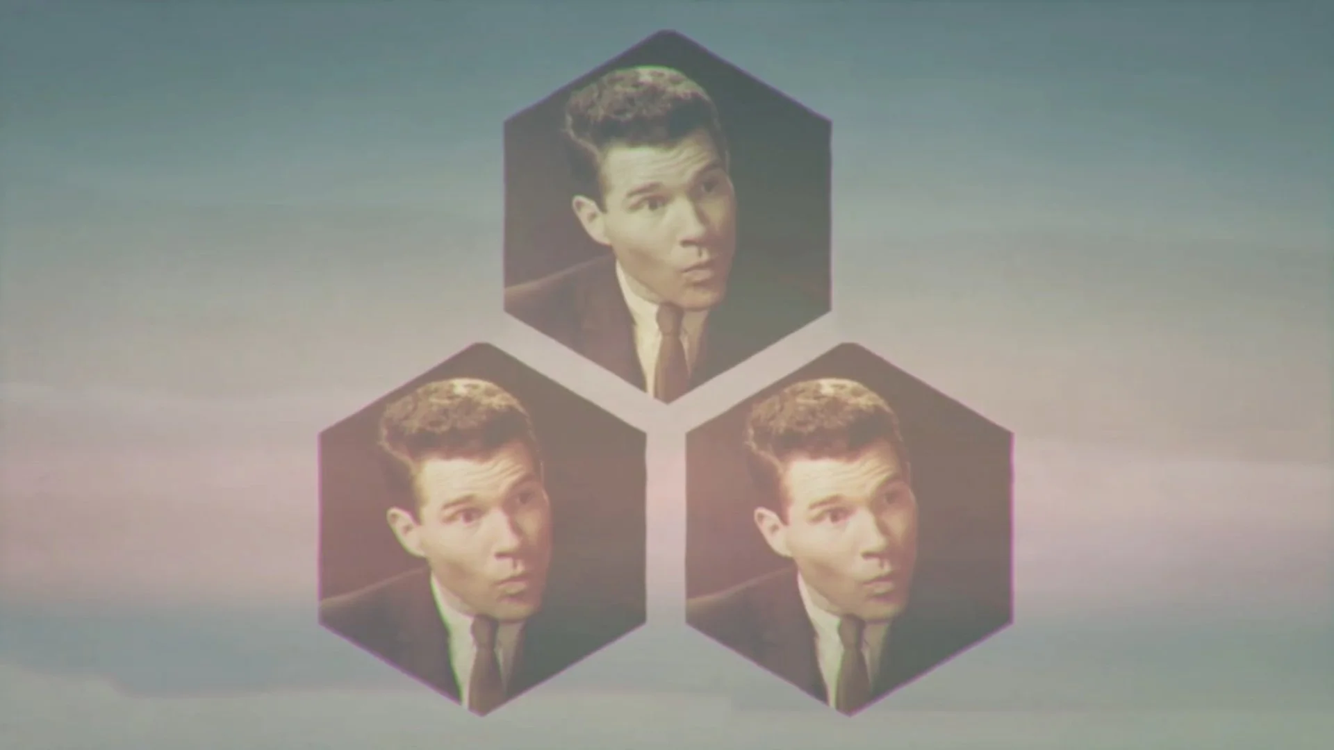 Three hexagons with the image of a man with neatly combed dark hair, wearing a suit and tie.