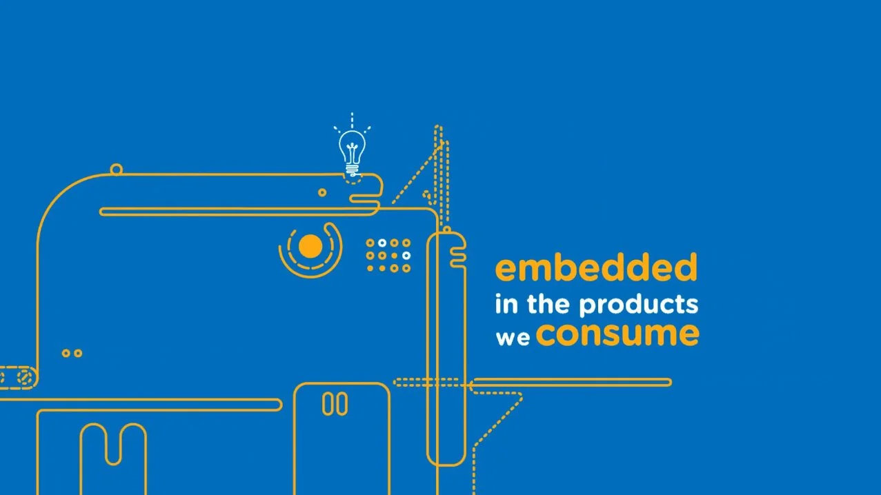 Blue background with a simple yellow line drawing of a machine, and text that reads "embedded in the products we consume."