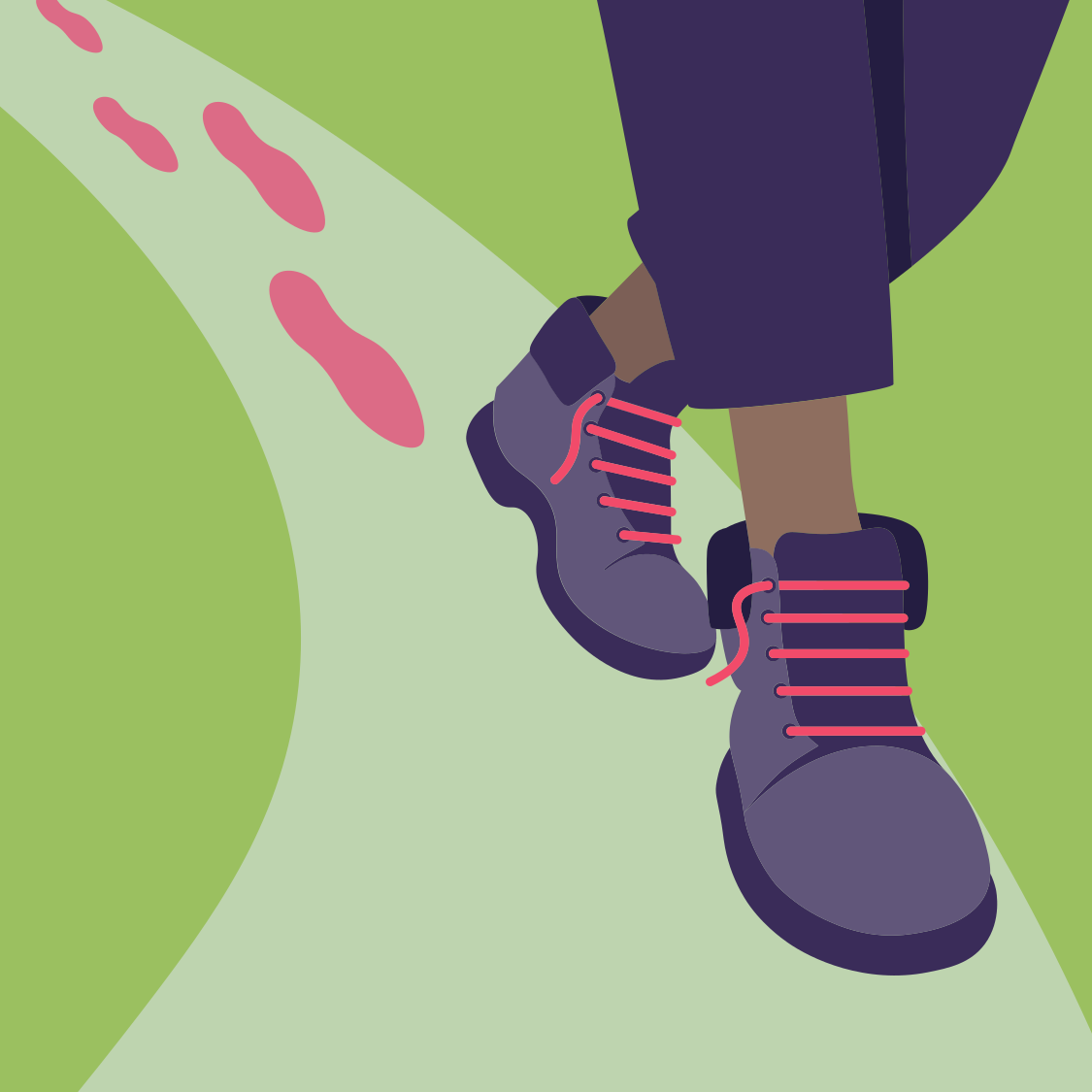 Person walking on a trail wearing hiking boots and dark pants.