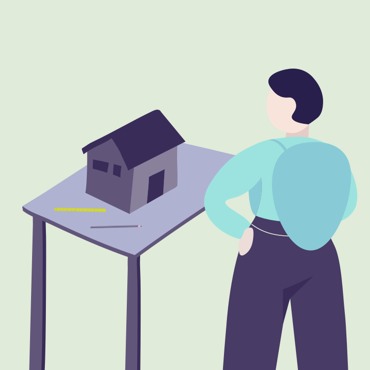 A person standing with arms crossed near a table with a small house model, a measuring tape, and a pen on it.