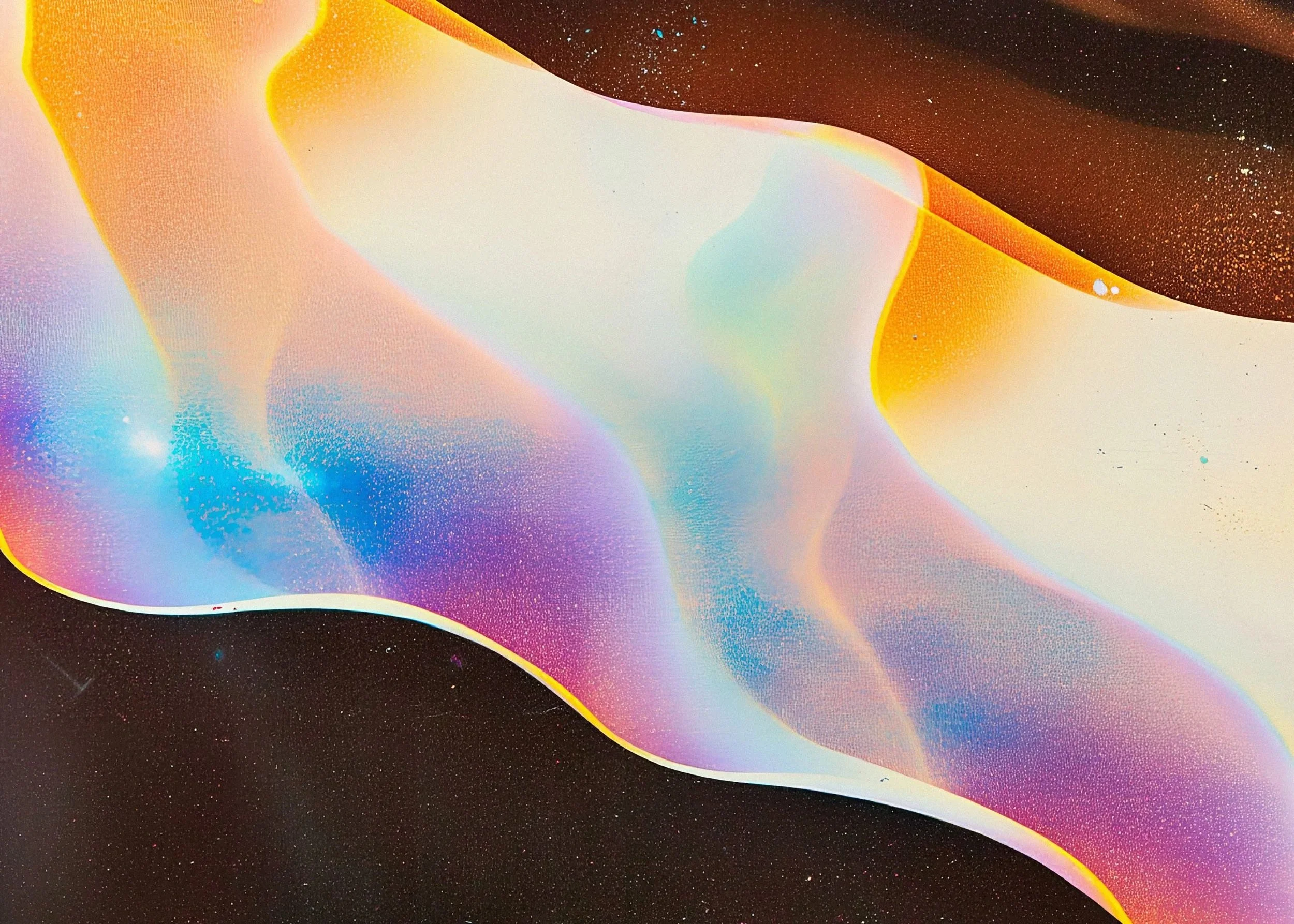 Close-up of a colorful, iridescent, abstract design with swirling patterns and speckles, resembling a cosmic or oil slick effect.