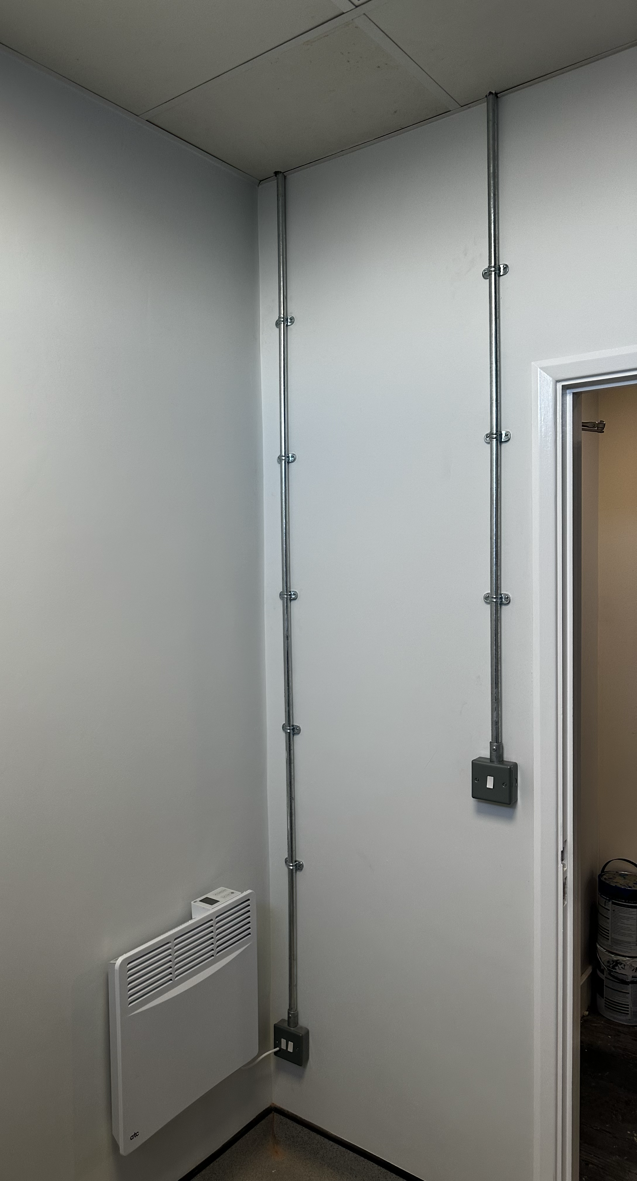     Surface mounted electrical conduit and accessories installed inside a commercial property.