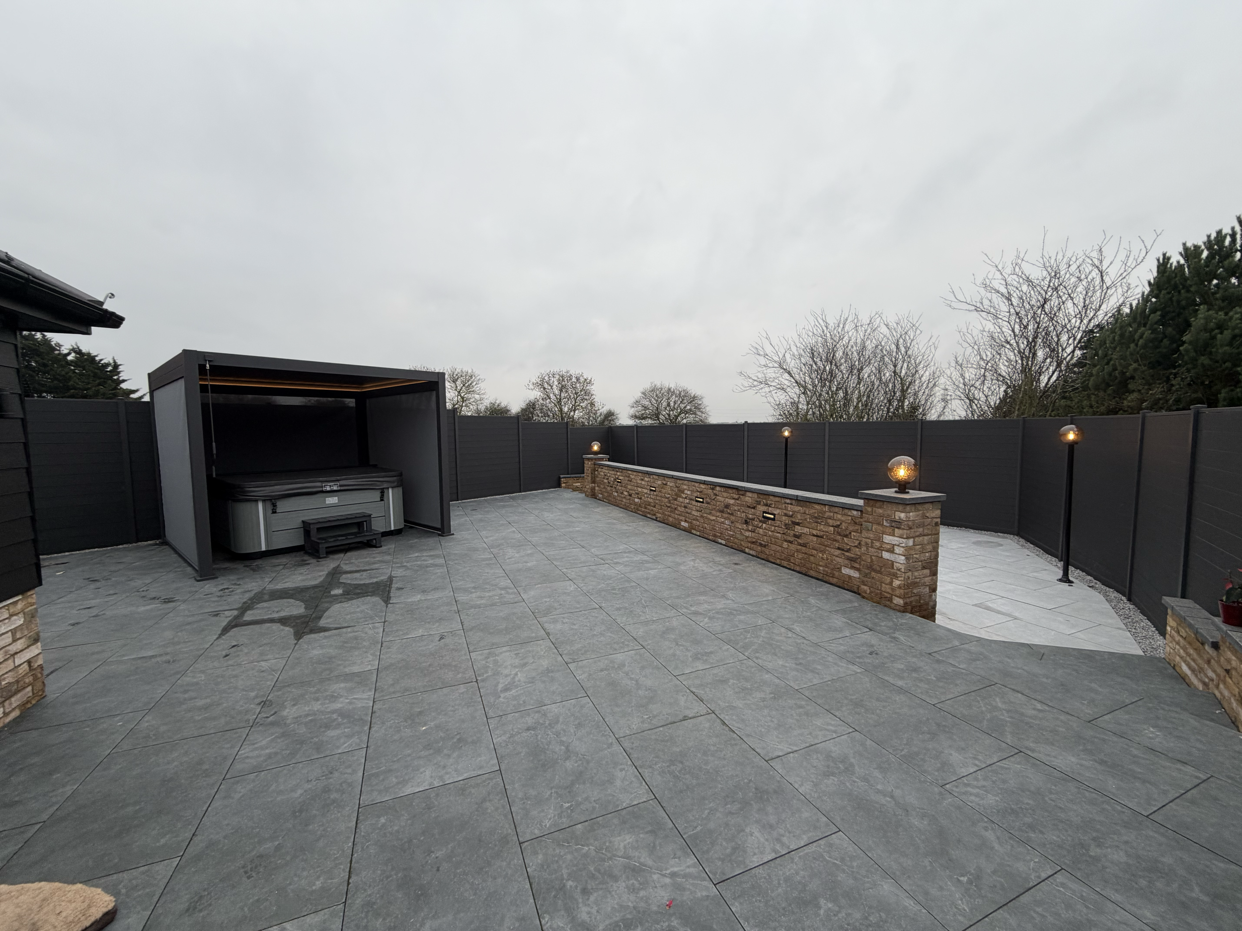     Completed outdoor lighting installation around a modern residential patio.