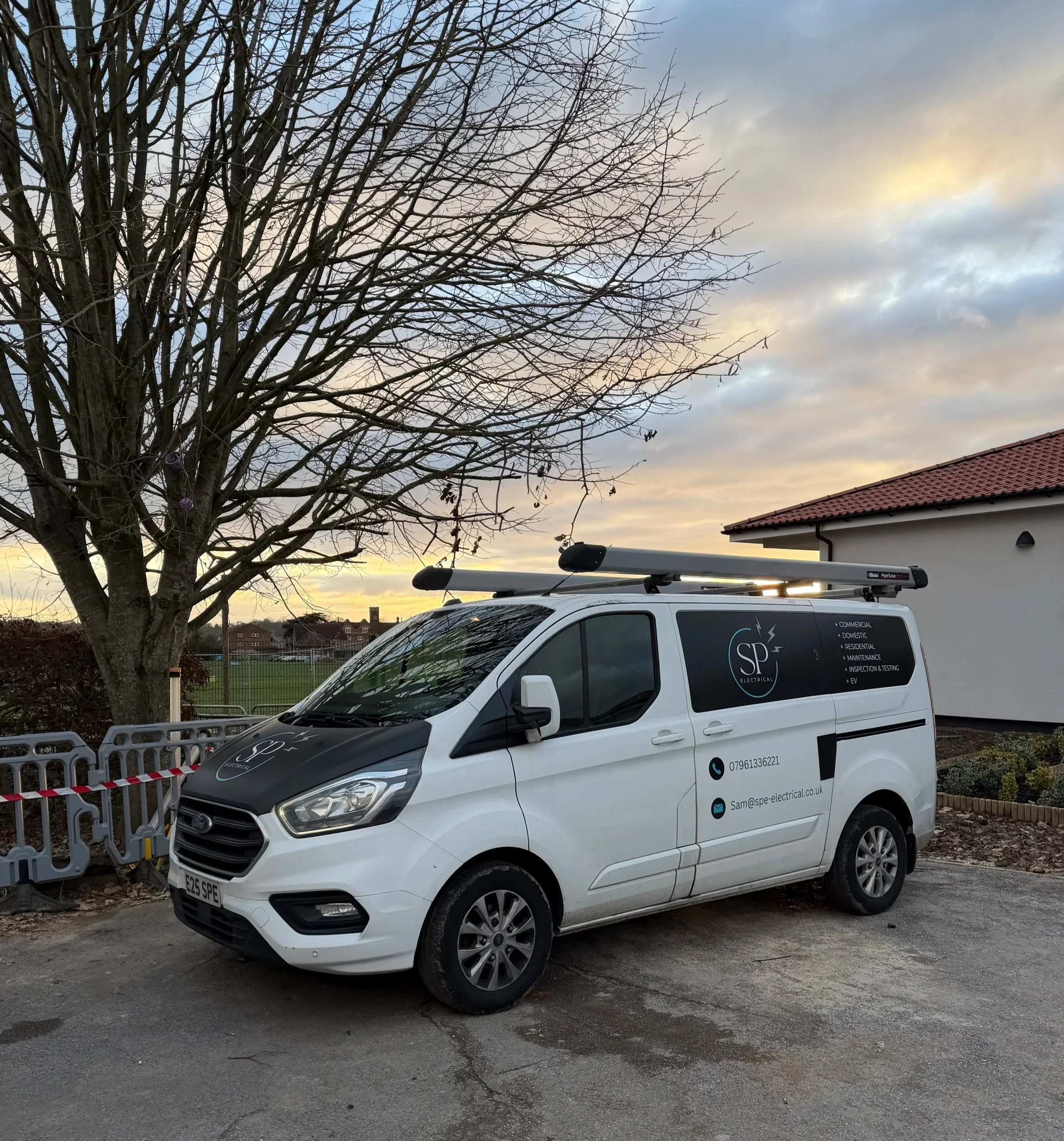 SP Electrical branded van parked outside a residential property.
