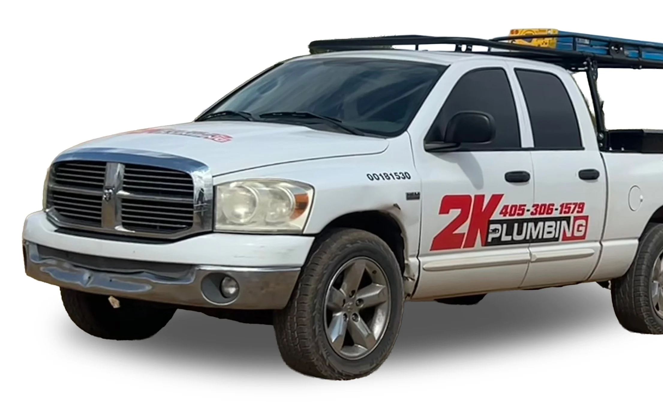 White pickup truck with a ladder on top and red and black company logo on the side reading "2K Plumbing" and phone number "405-306-1579."