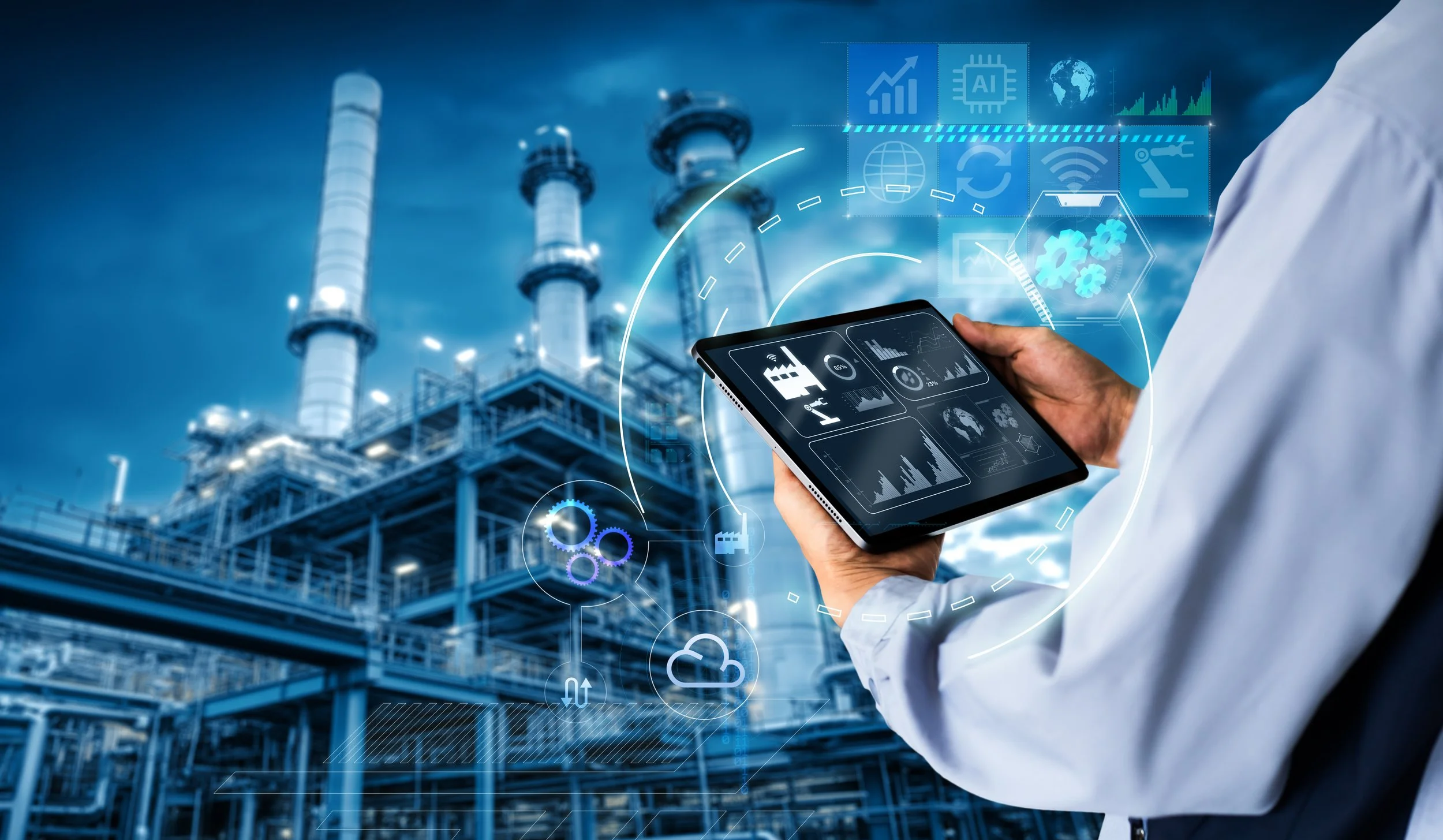 A person in a white lab coat holding a tablet with digital graphs and icons in front of an industrial petrochemical plant with towers and pipes, with digital overlay graphics related to technology and data.