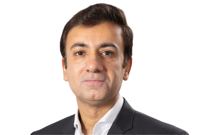 Portrait of a man in a dark suit and white shirt against a white background.