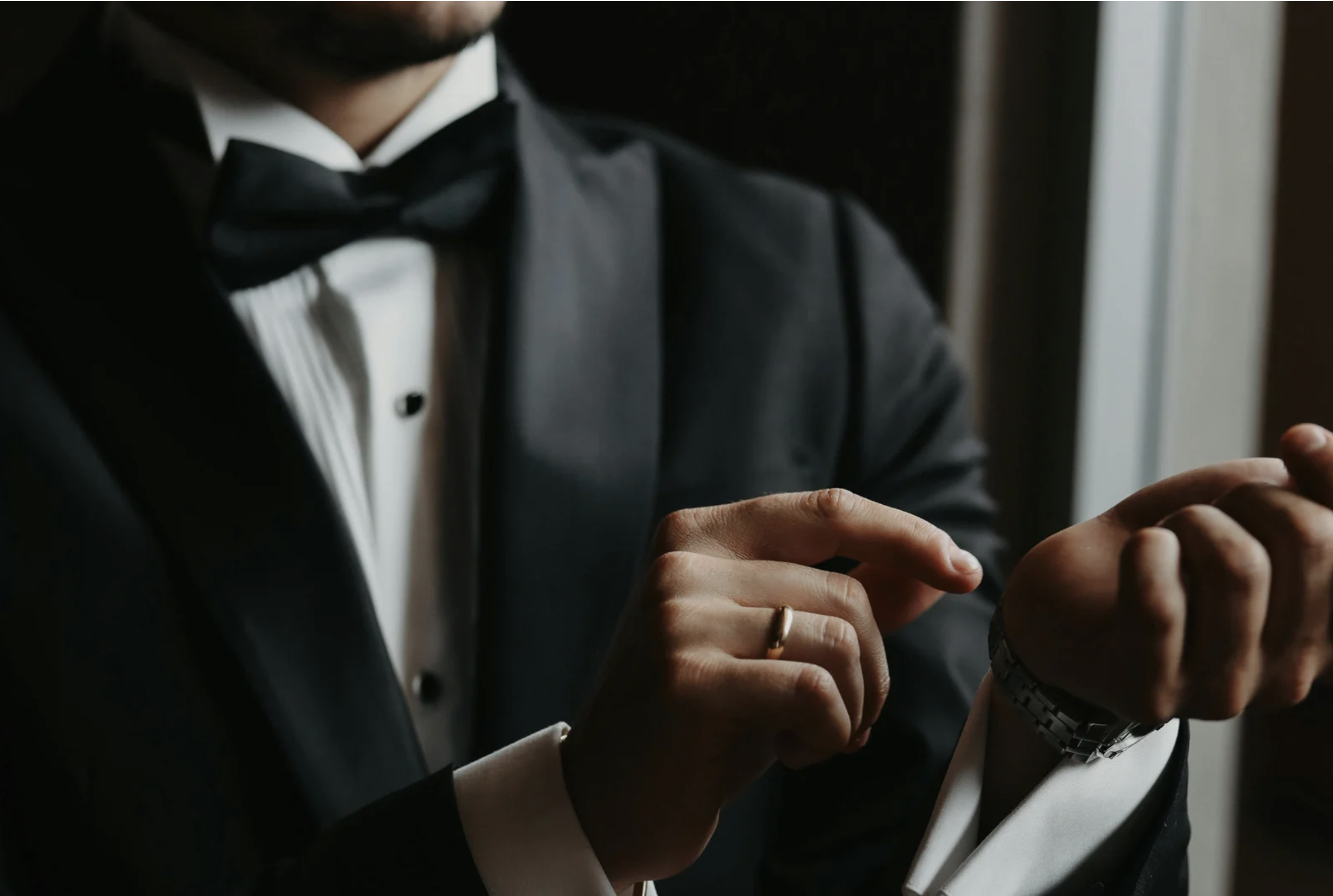 Man wearing a formal black tuxedo for a wedding or special event