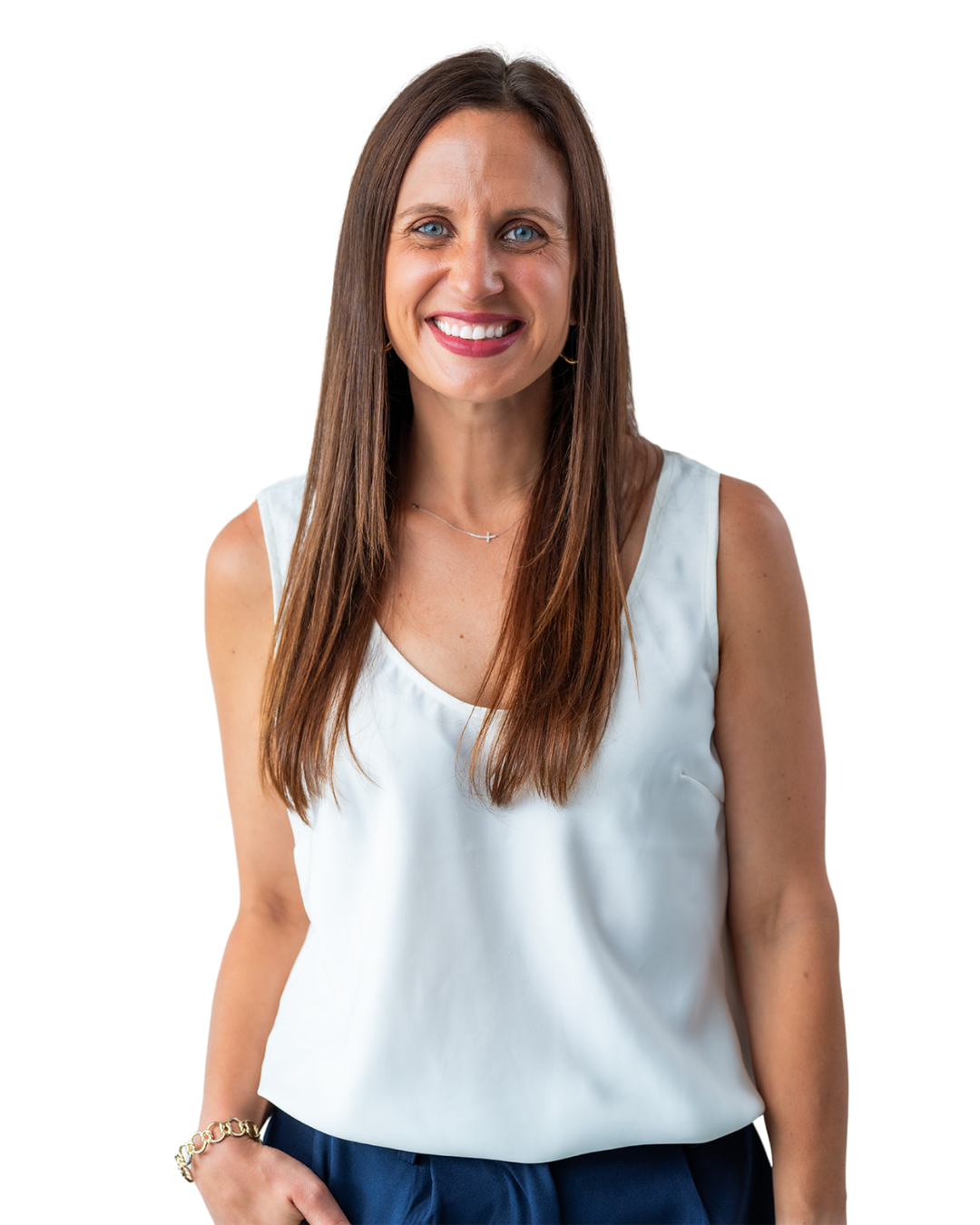 Lisa Tarkington - Smiling woman with long brown hair, wearing a white sleeveless top, navy pants, and jewelry, against a black background.