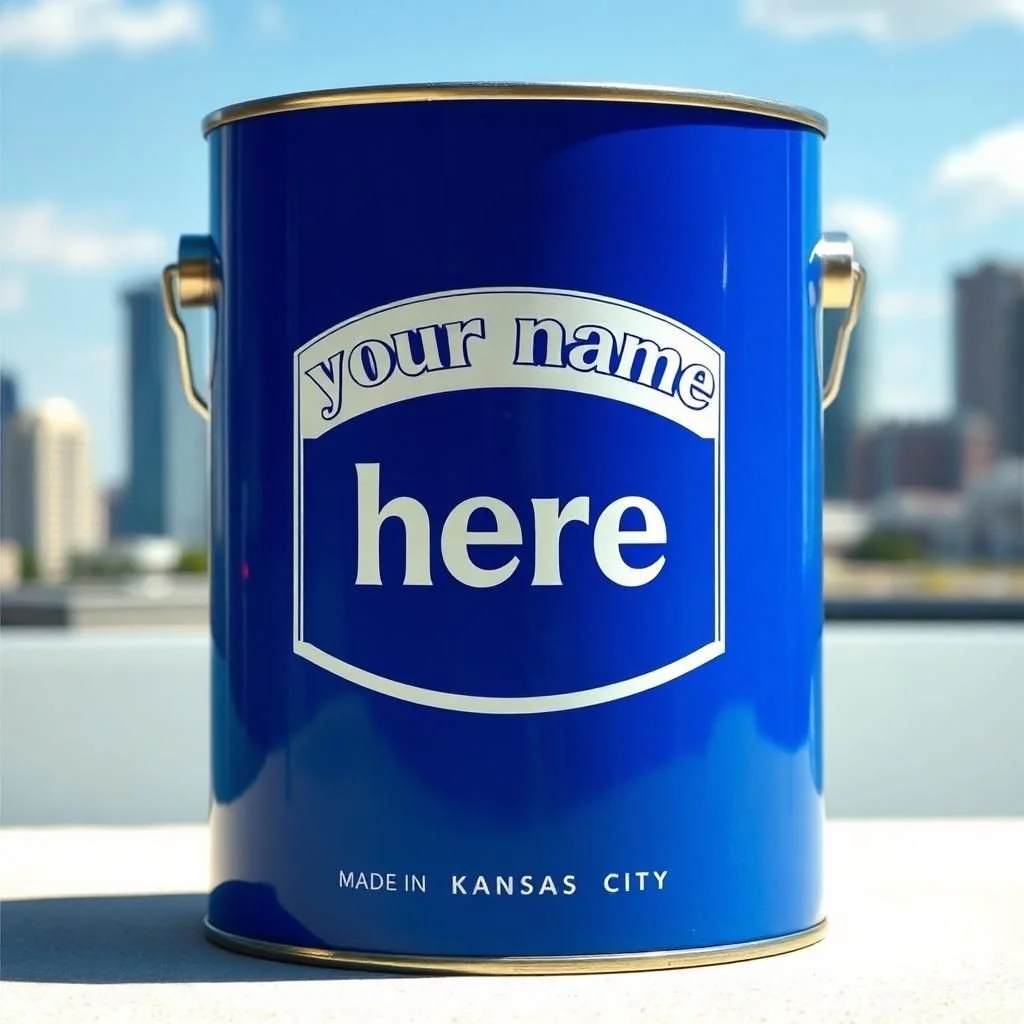 A blue paint can with space for custom text, saying 'your name here,' made in Kansas City, with a cityscape in the background.